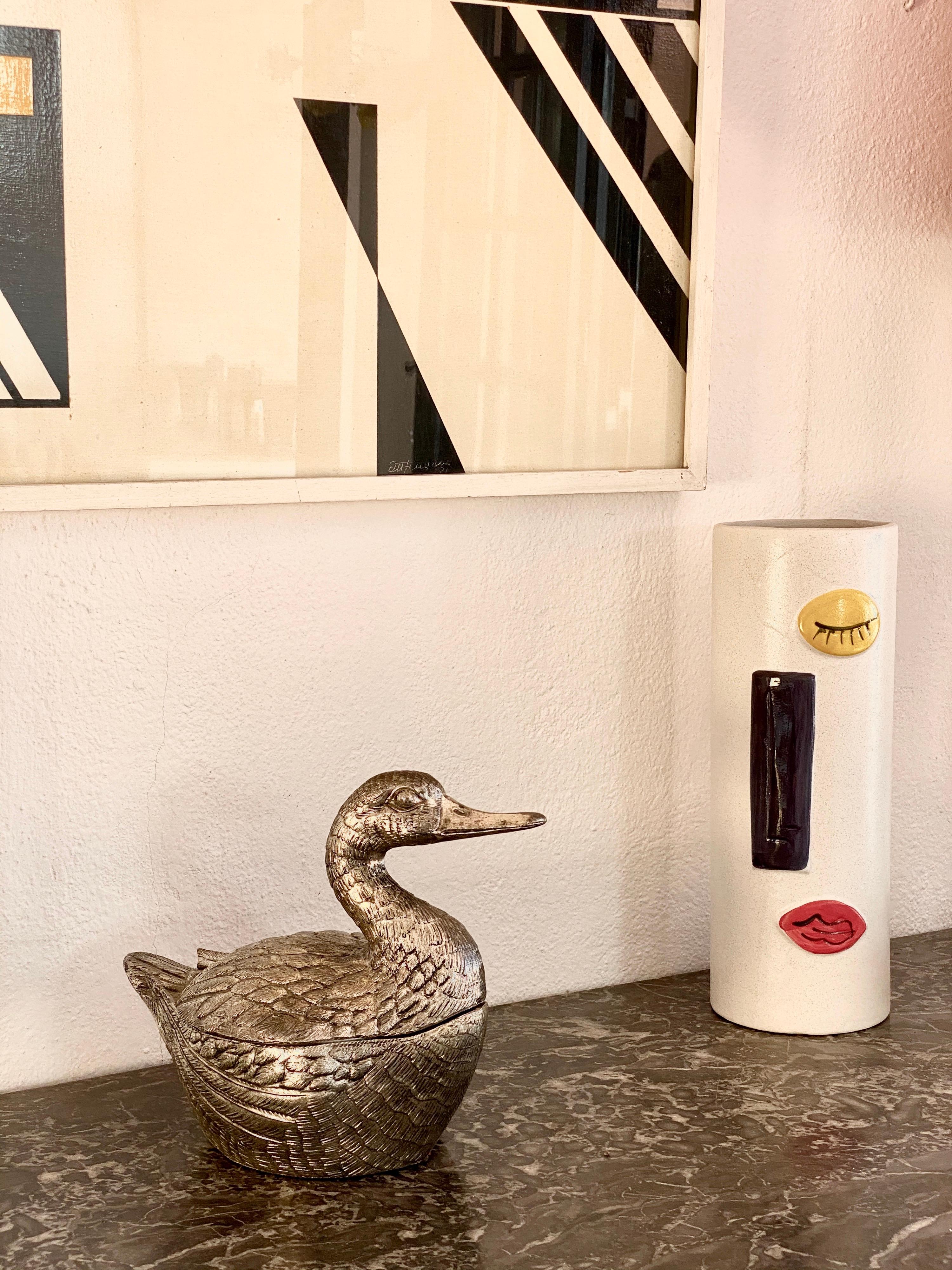 Original duck ice bucket designed by Mauro Manetti manufactured by Fonderia d'Arte Firenze in 1950.
Stamped on the base MM Made in Italy.


 