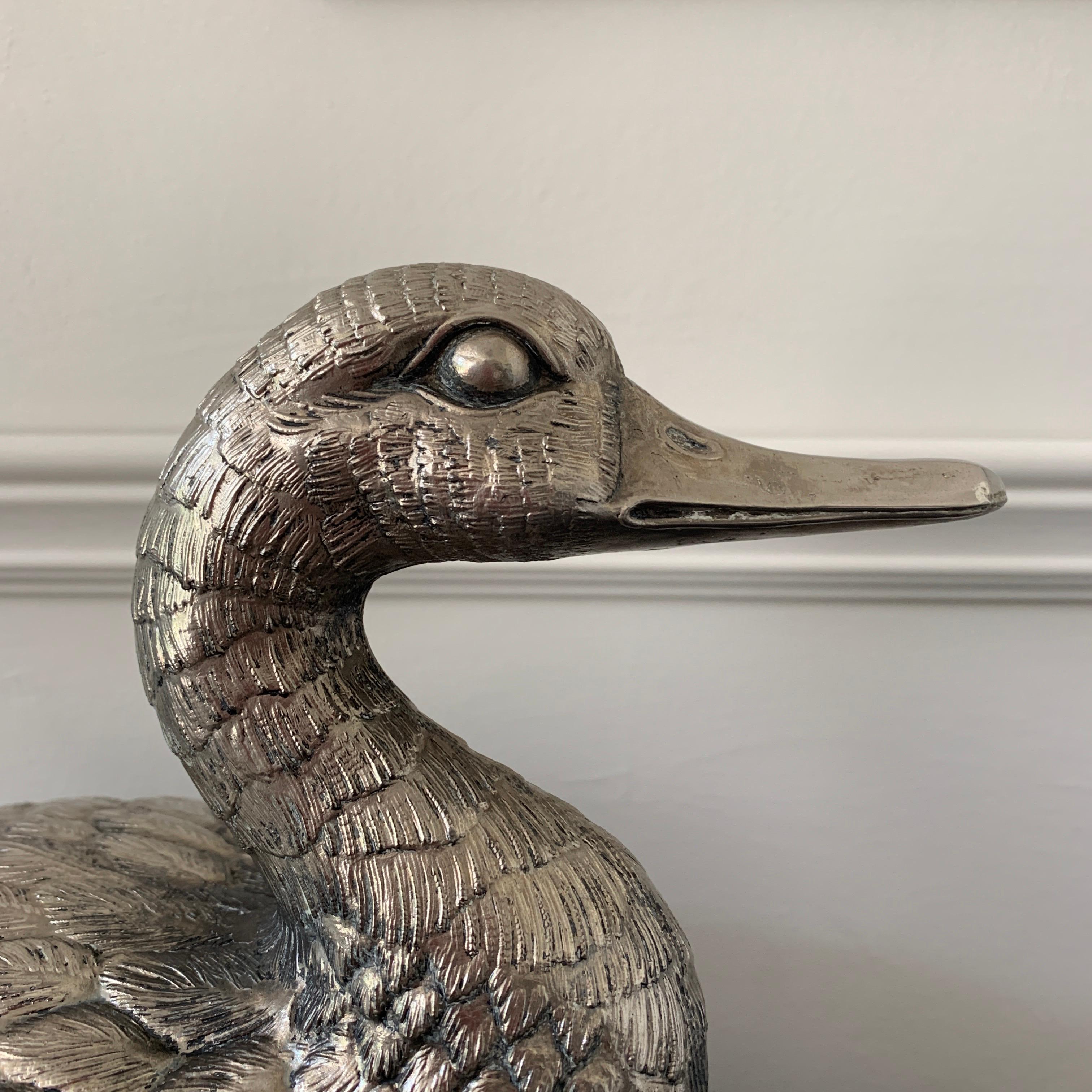 Fabulous duck ice bucket by Mauro Manetti, Italy
circa 1960s
Pewter
The duck still has a silver finish
Some minor loss to the wing tip but this is hard to notice unless advised, we have shown this in the photograph
There is no liner in the lid