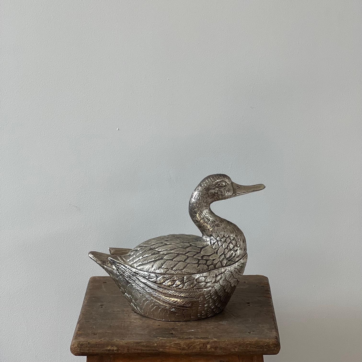 A Mauro Manetti 1960s 'Duck' shaped ice bucket, from Italy. 

c1960s, Italy. 

In good vintage condition retaining it's original liner, but there is evidence of wear commensurate with age. 

Highly decorative and functional, a quirky addition