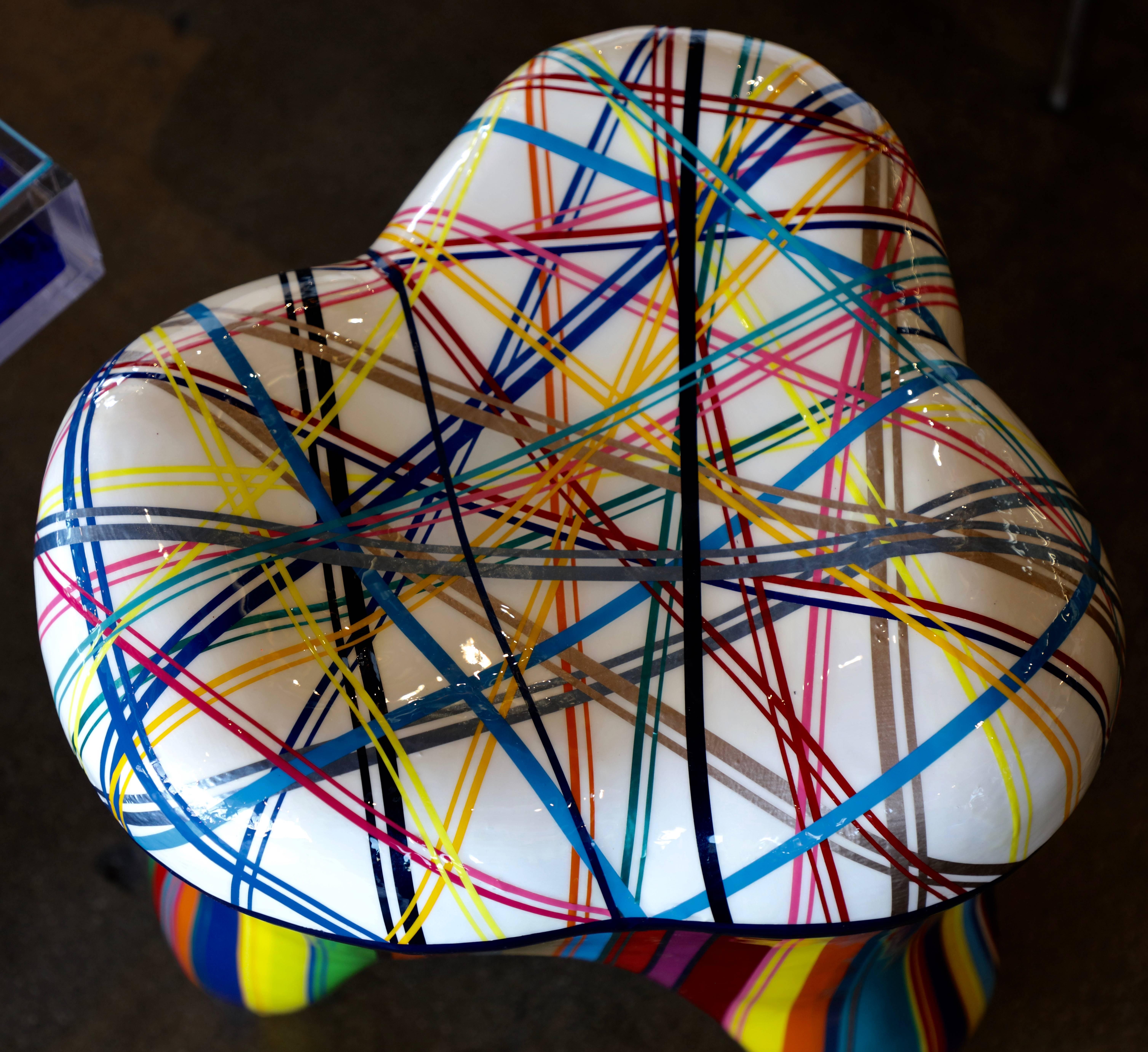 A wonderfully decorated stool by the noted Brazilian American artist Mauro Oliveira. The stool is fiberglass that Mauro has magically transformed. It is signed on the back. Please note that this stool cannot be used outdoors. Biography Best known