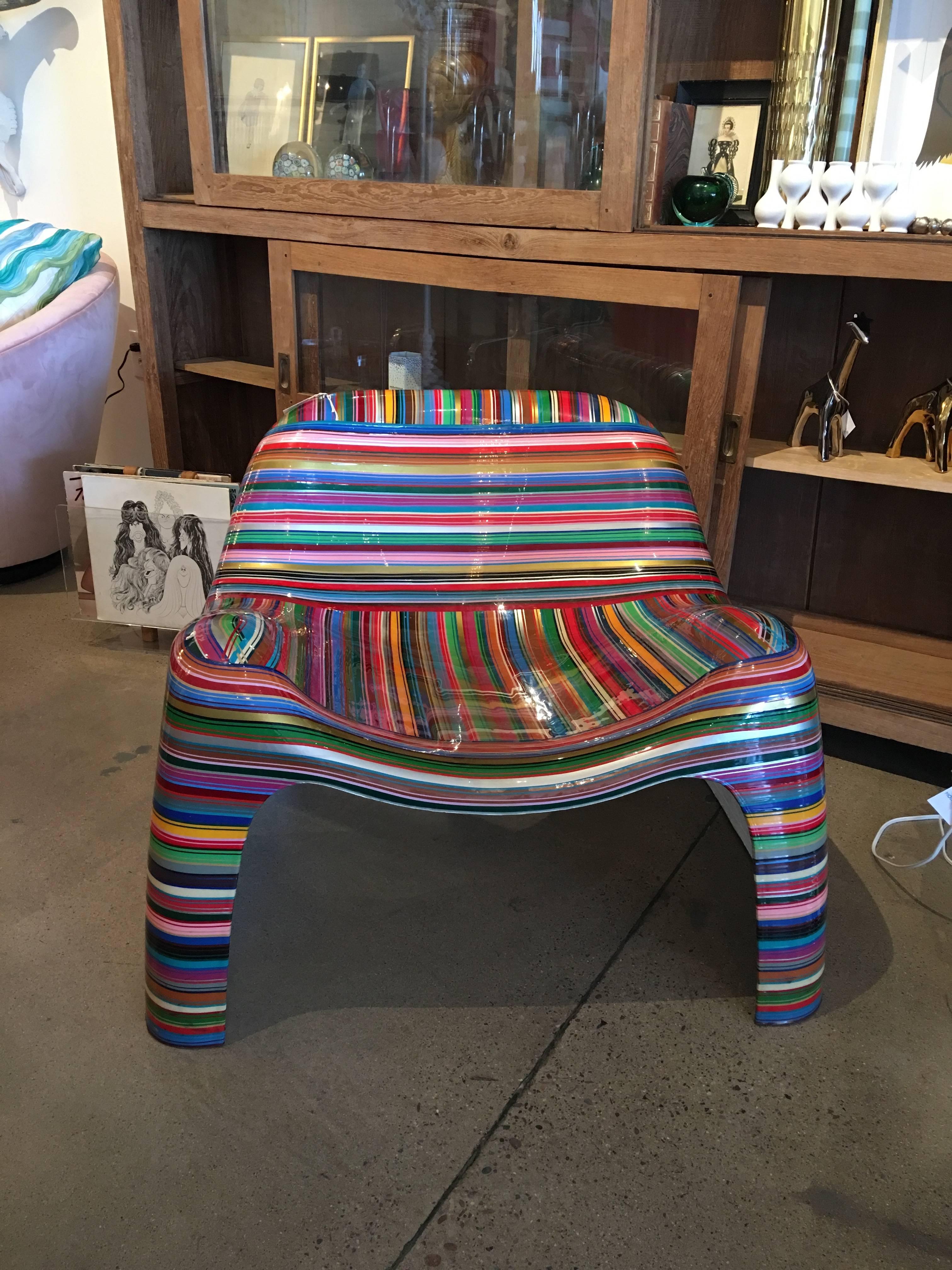 This iconic midcentury chair has been painted by the Brazilian artist, Mauro Oliveira. The paint texture is layered and three dimensional in multiple colors. It is signed by the artist. Finally a chair as modern art and with a comfortable