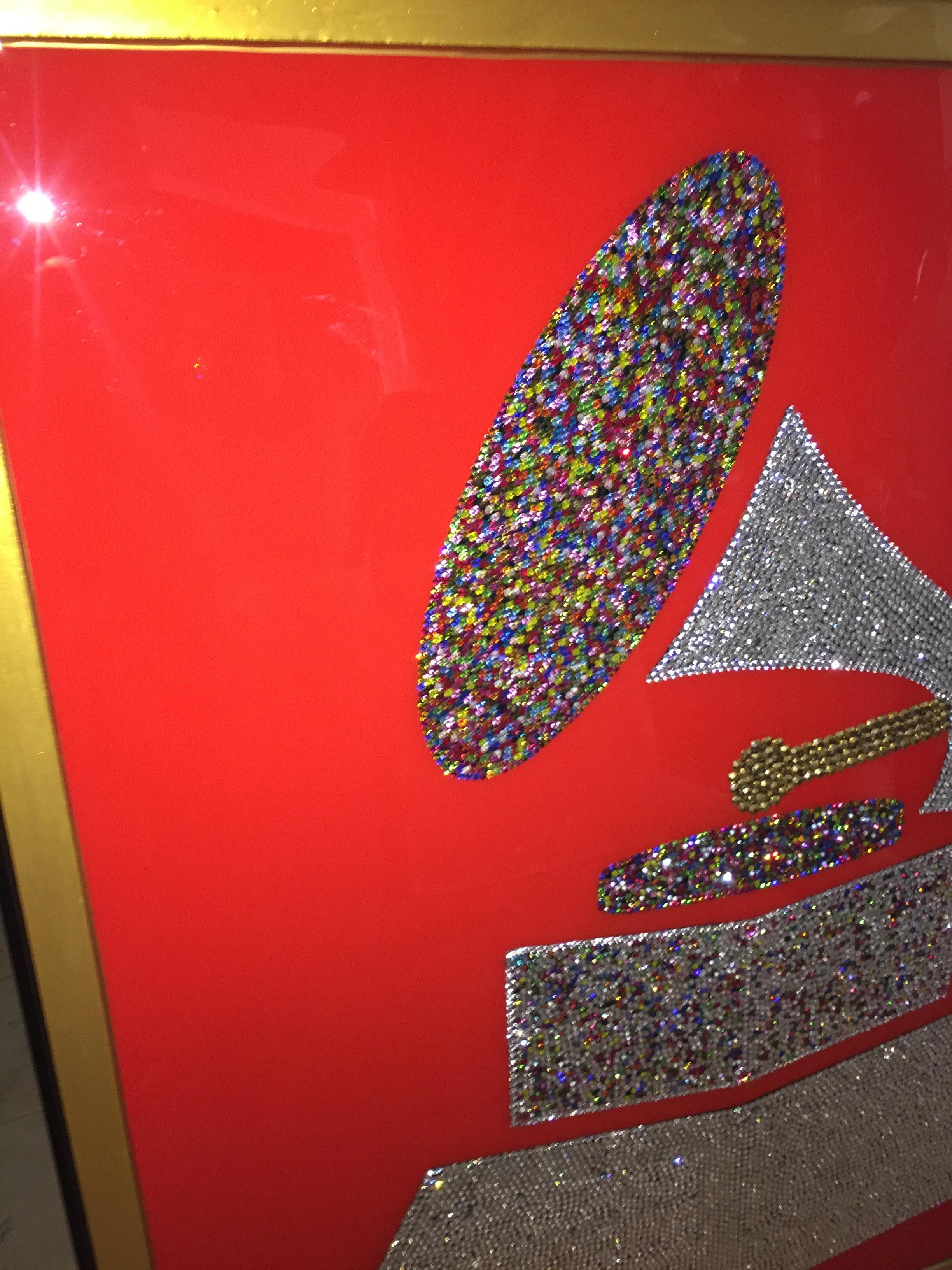 One of a kind piece of art with 10.000+ Swarovski+Czech Crystals placed one by one. The artist took over 2 months to complete it. This Grand Grammy piece celebrates the 60th anniversary of the Grammys. This is already framed, perfect for that