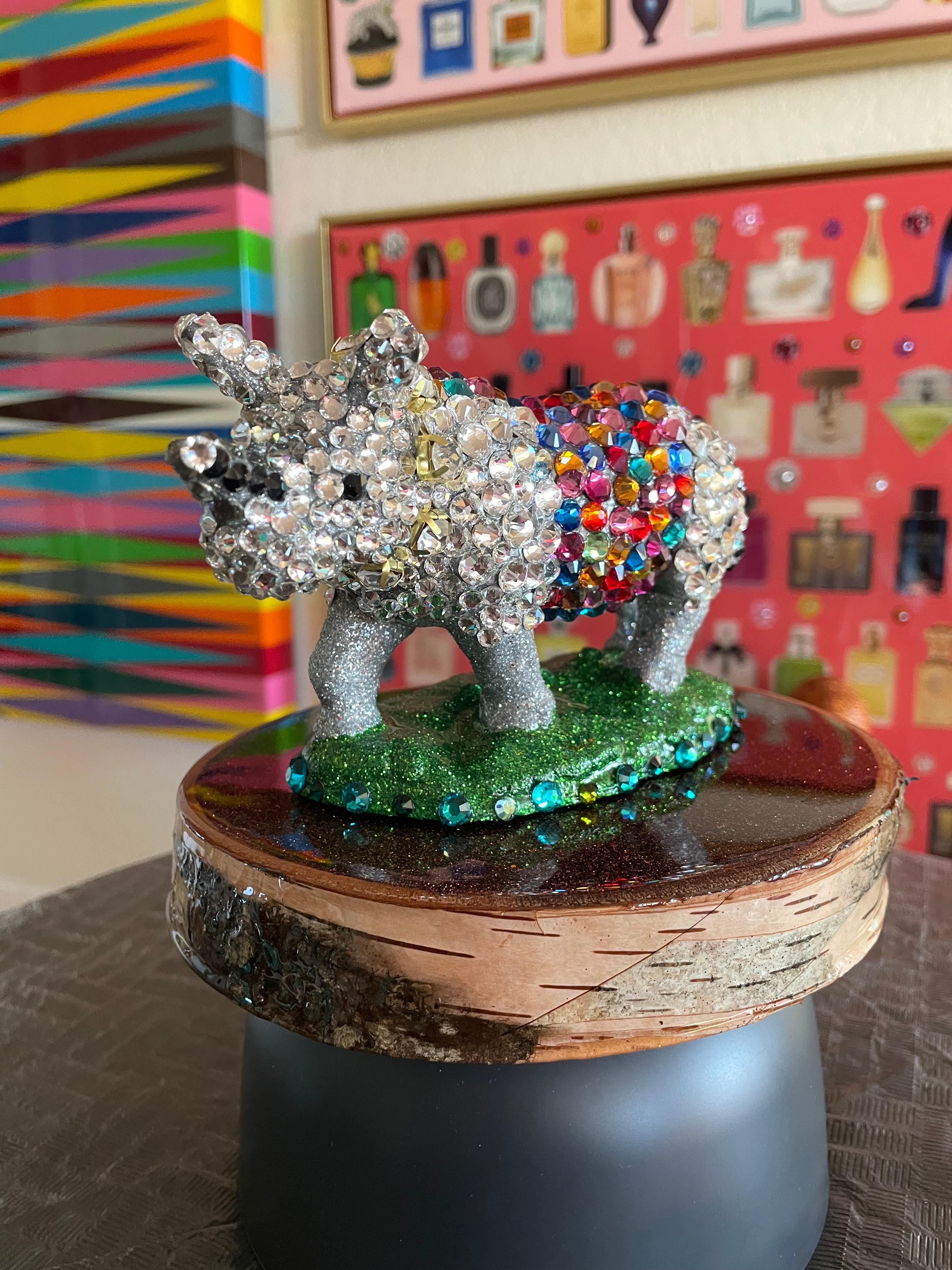 >>LIMITED TIME SALE<<

ONE of a kind RESIN Rino sculpture encrusted with genuine Swarovski crystals.

**SIZE IS WITH THE CUSTOM MADE WOOD BASE**

This is an homage to the colorful Africa.

The piece has a customized glittered wood base covered with