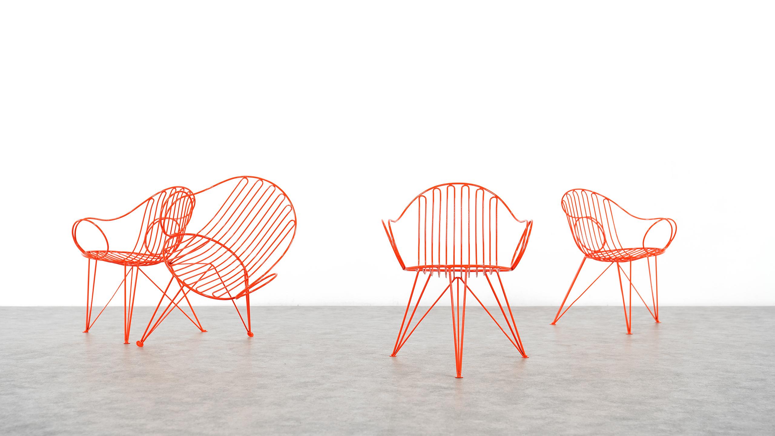 Mauser Waldeck, Germany - extremely beautiful and rare set of 4 garden chairs,
circa 1950, in absolutely bright orange!
 
Stunning curly and massive steel-construction, newly powdercoated in bright orange, for indoor use or as well for