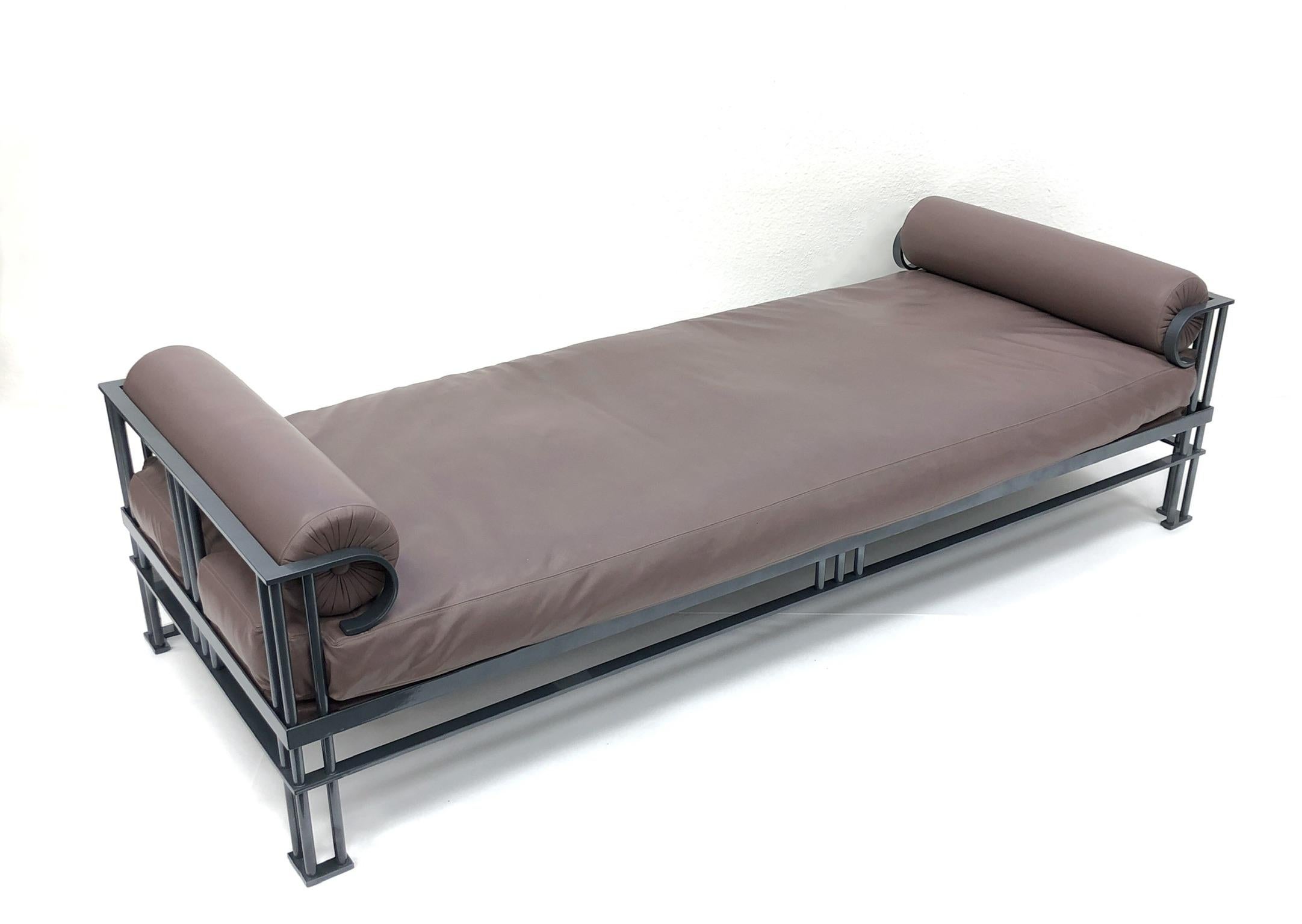 A spectacular 1980s Post-Modern Attila daybed designed by French Architect Jean Michele Wilmotte for Mirak and special ordered by Steve Chase. The Daybeds frames is solid steel that has been newly powder coated charcoal gray as originally was. The