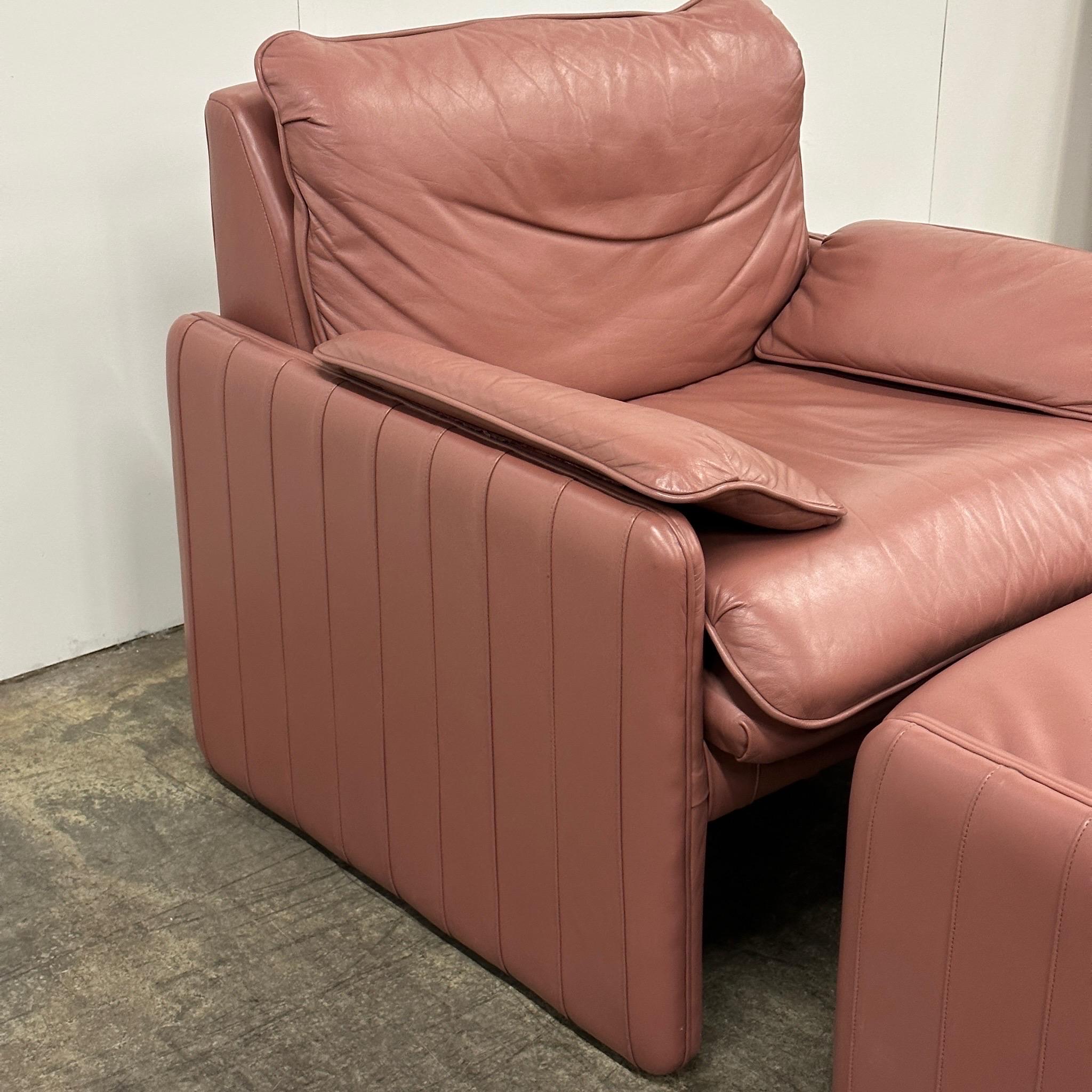 c. 1980s. Price is for the set. Contact us if you’d like to purchase a single item. Made in North Carolina. Top grain leather dyed mauve. 

Ottoman dimensions are 27”L x 22”W x 14.5”H  