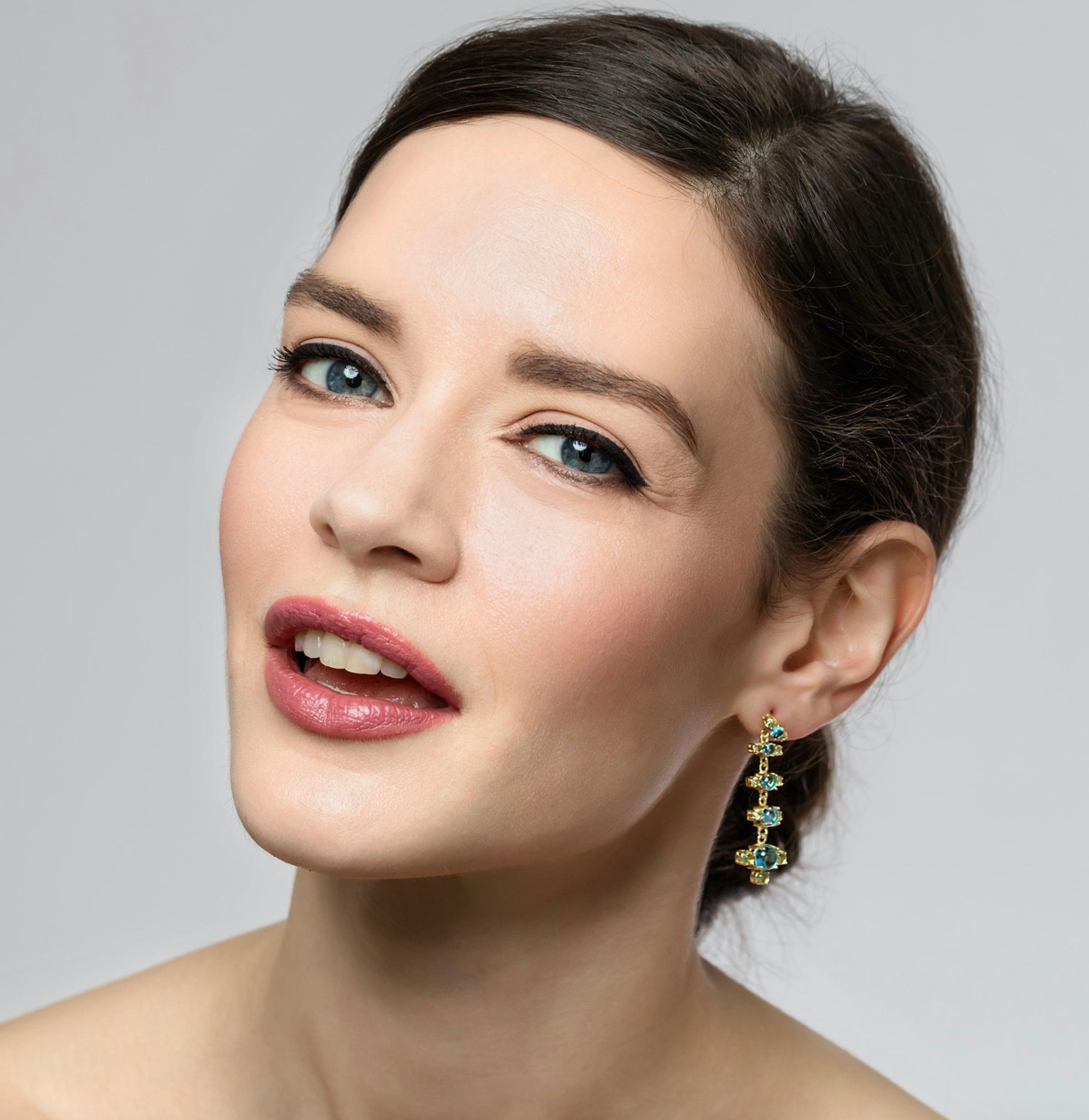 Our + Earrings in 18k yellow gold and brilliant coloured natural gemstone combinations are so feminine and chic. They come in three beautiful coloured combinations: Swiss Blue Topaz and green Peridot, green Peridot and Pink Tourmaline and Purple