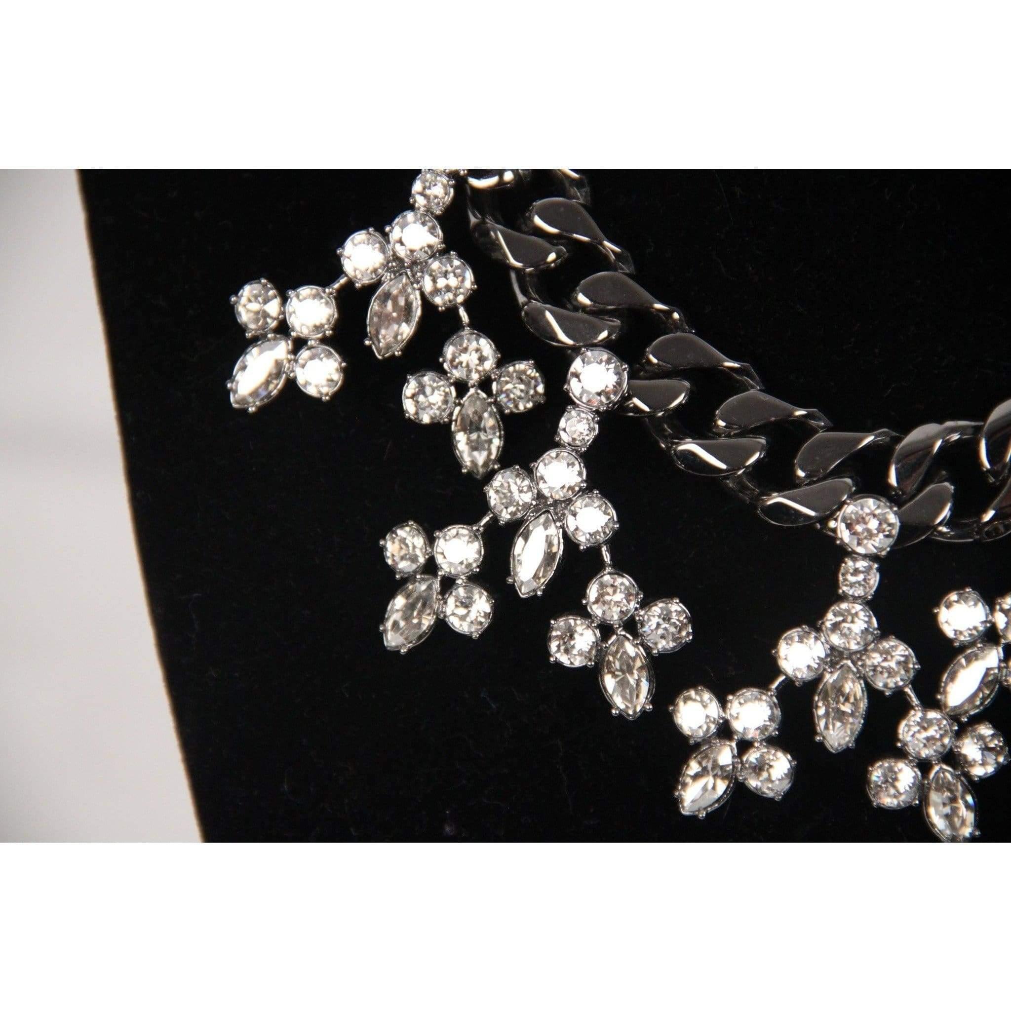 - MAWI LONDON gunmetal necklace - Chain necklace embellished by 5 crystal elements on the front - Clasp closure - Stamped 'MAWI' on the closure - Measurments: 16 1/2 inches - 41,9 cm Condition: A :EXCELLENT CONDITION - Used once or twice.