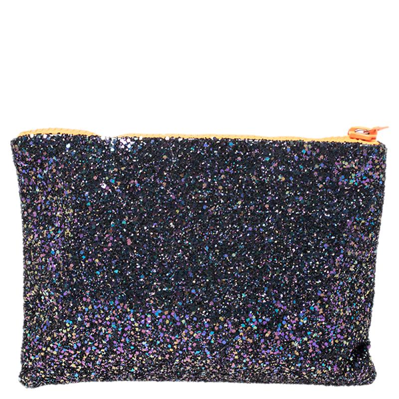Complete your party look with this clutch from Mawi. Fashioned in glitter, the clutch is decorated with crystals and acrylic perspex embellishments on the front, which adds a glamorous finish to this lovely piece. It has a fabric-lined compartment