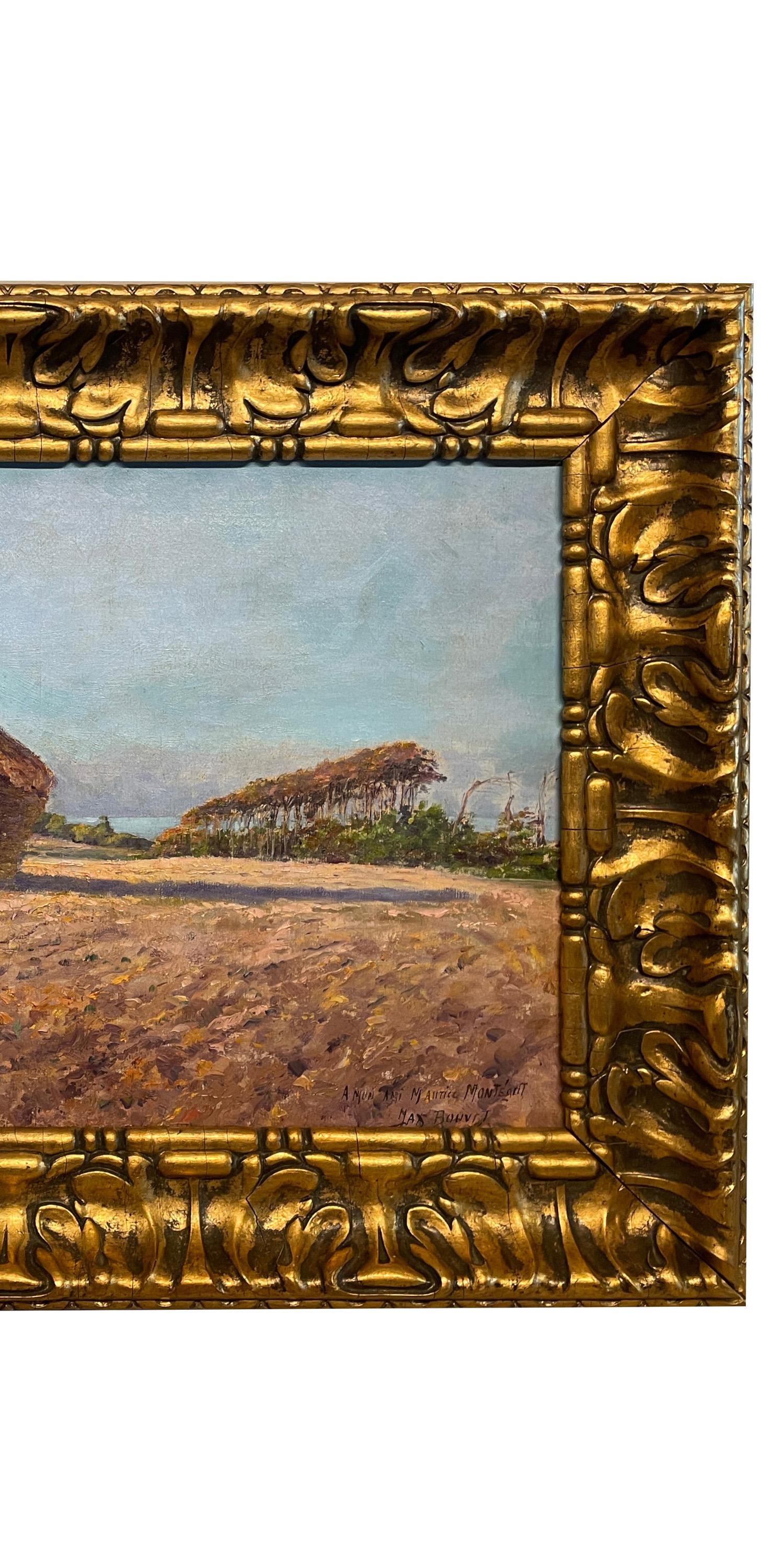 A very attractive antique oil on canvas landscape painting by the French Post Impressionist artist Max Bouvet (1854-1942), the painting circa 1890.
The painting depicts a pastoral scene of a quintessentially French haystack of conical form with a