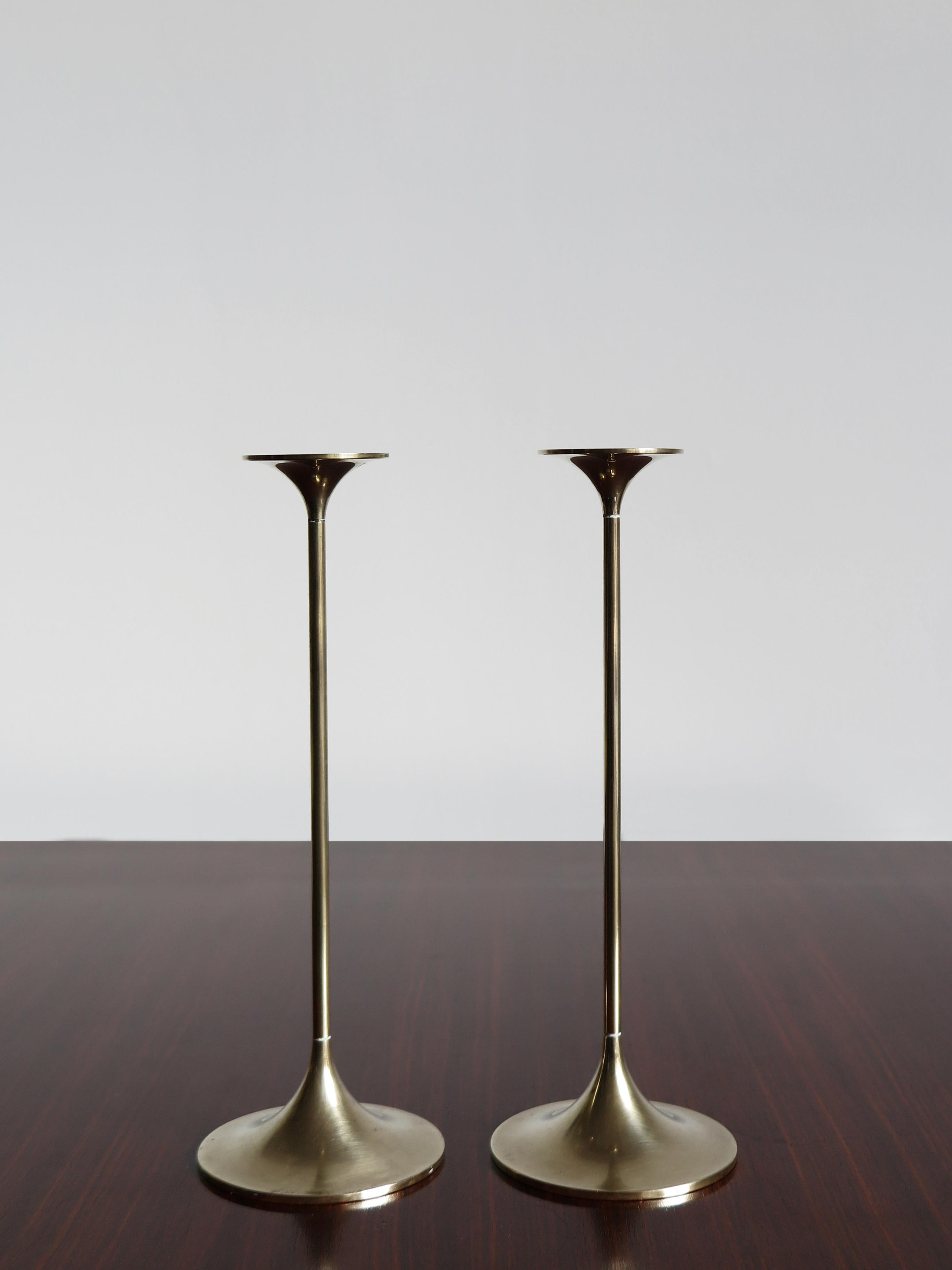 Pair of solid brass Mid-Century Modern design Scandinavian candleholders designed by Max Brüel for Torben Ørskov with engraved manufacturer logo, Denmark, circa 1950.

Please note that the items are original of the period and this shows normal