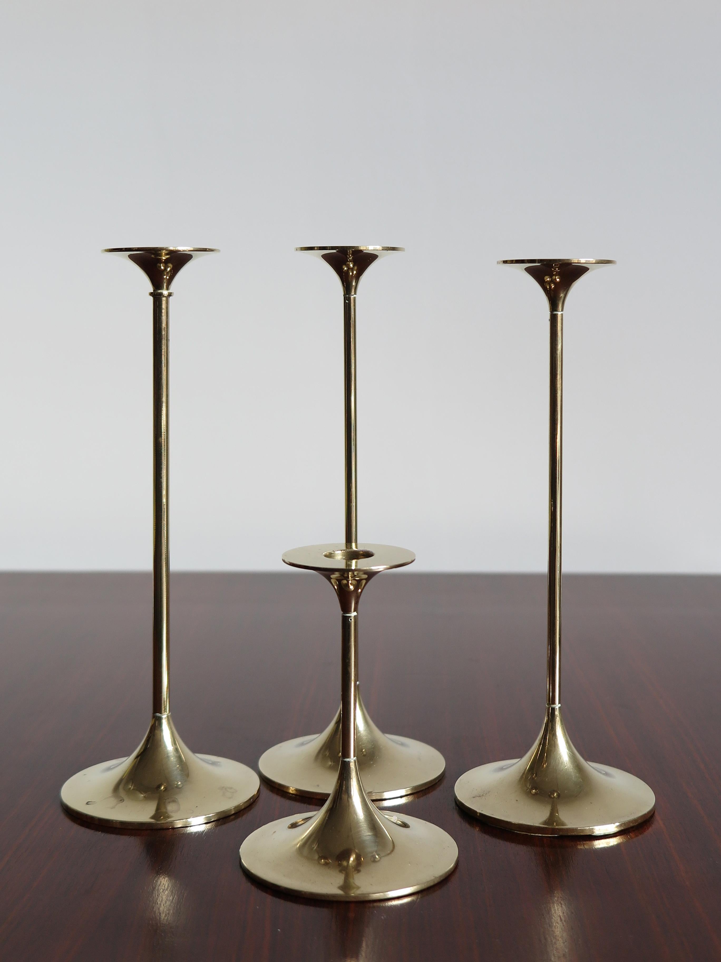 Set of four Mid-Century Modern design solid brass Scandinavian candleholders designed by Max Brüel for Torben Ørskov with engraved manufacturer logo, Denmark, circa 1950.

Please note that the items are original of the period and this shows normal