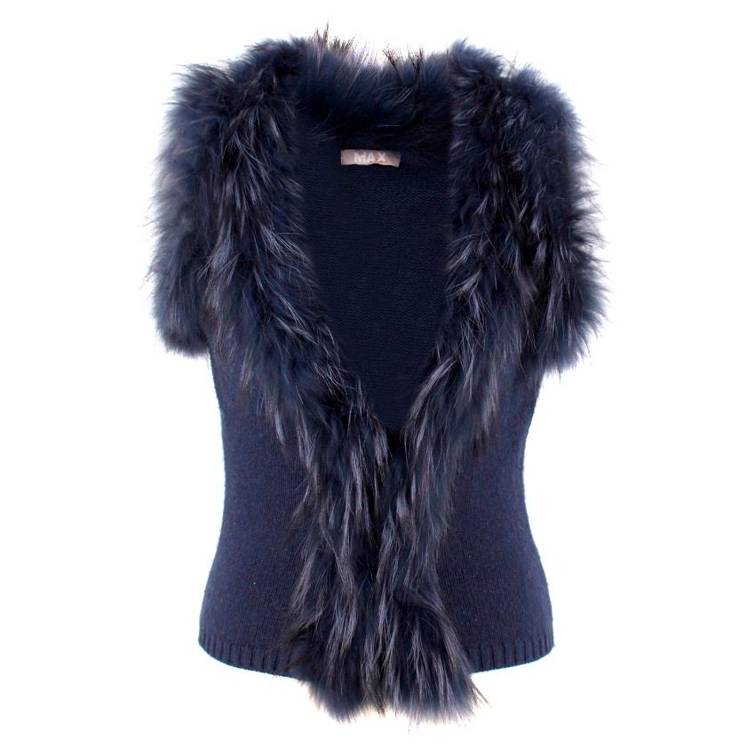 Max by Lederer Cashmere & Wool Gilet

- Sleeveless
- Ribbed hemline
- Racoon fur collar
- 2 concealed navy hook and eye closures to fasten

Approx
Measurements are taken laying flat, seam to seam. 

Length: 53cm
Waist: 36.5cm
