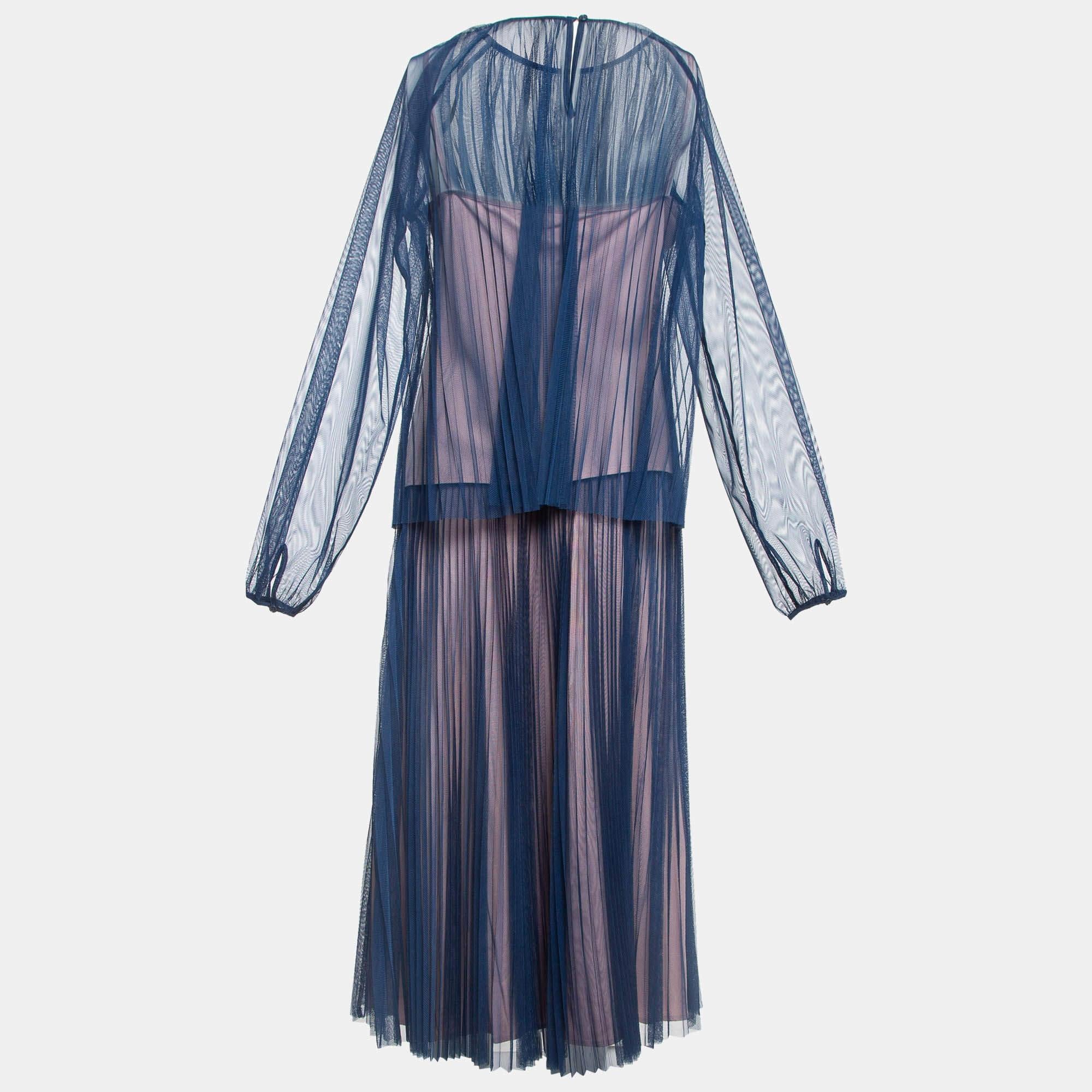 The Max and Co. set exudes timeless elegance. This sophisticated ensemble features a finely crafted sheer skirt with a matching top. The set is adorned with a subtle shade combining comfort and luxury in a versatile fashion statement.