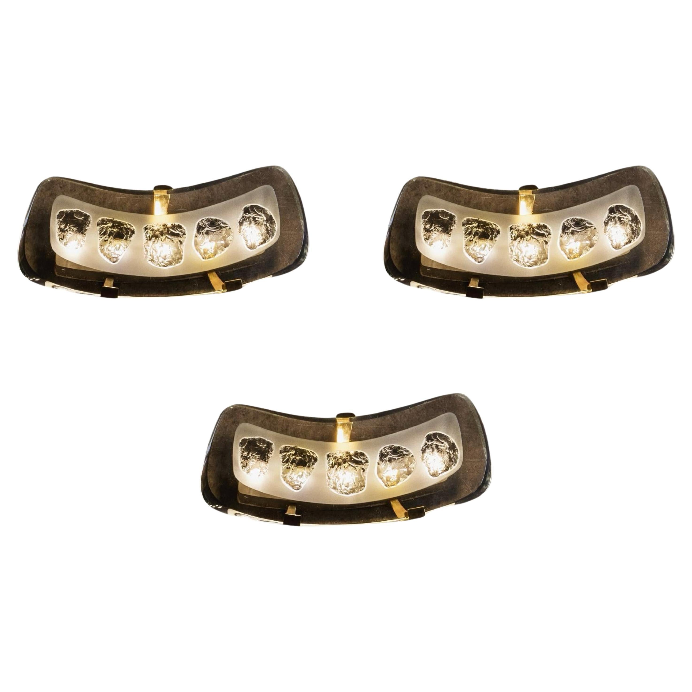 Max Ingrand “1598” sconces for Fontana Arte, glass, brass and metal, Italy, 1956, set of three.

The 