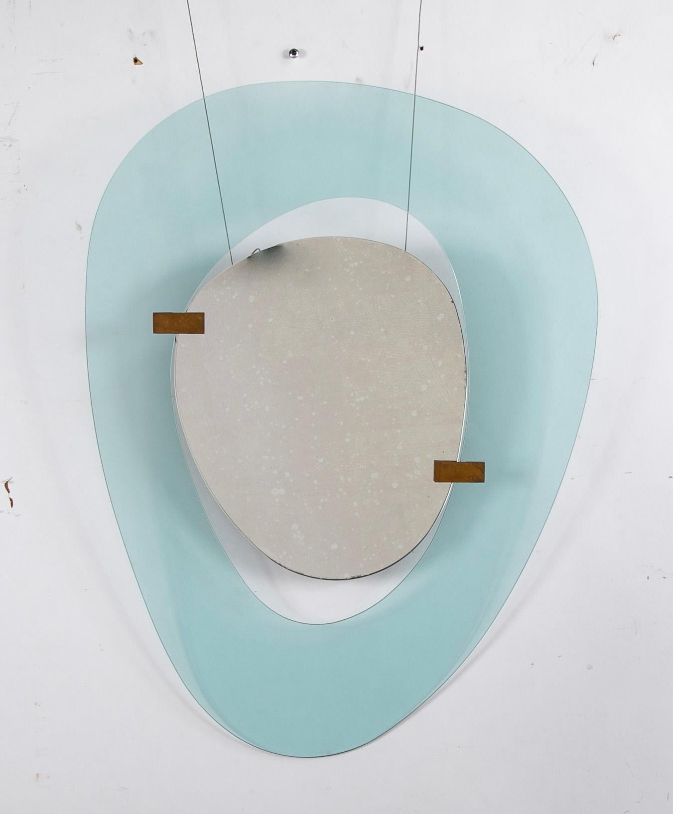 Max Ingrand for Fontana Arts sculptural mirror with asymetrical polished blue glass frame. 

