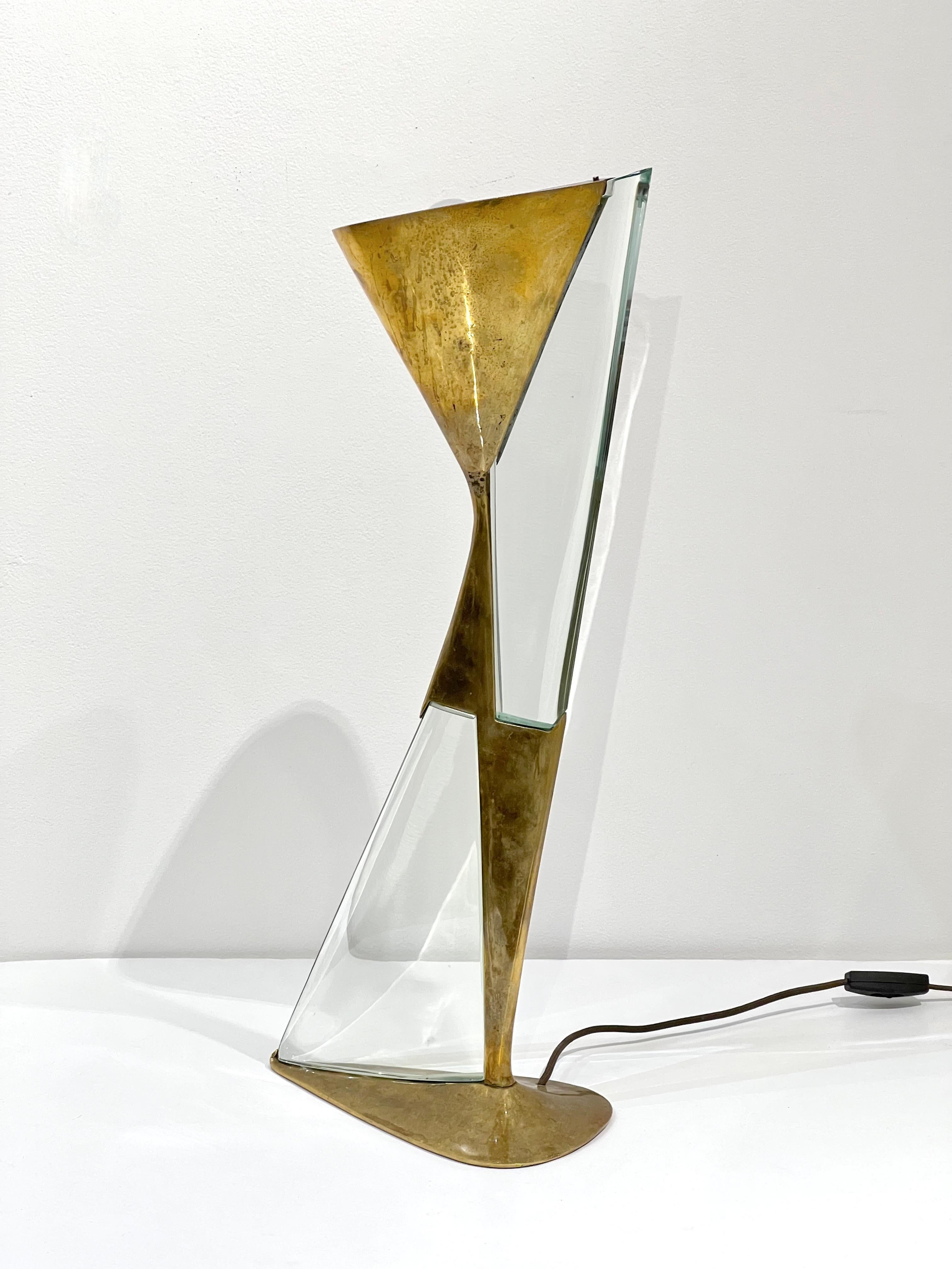 Striking hourglass shaped brass and glass table lamp by Max Ingrand for Fontana Arte. Italy circa 1960's.