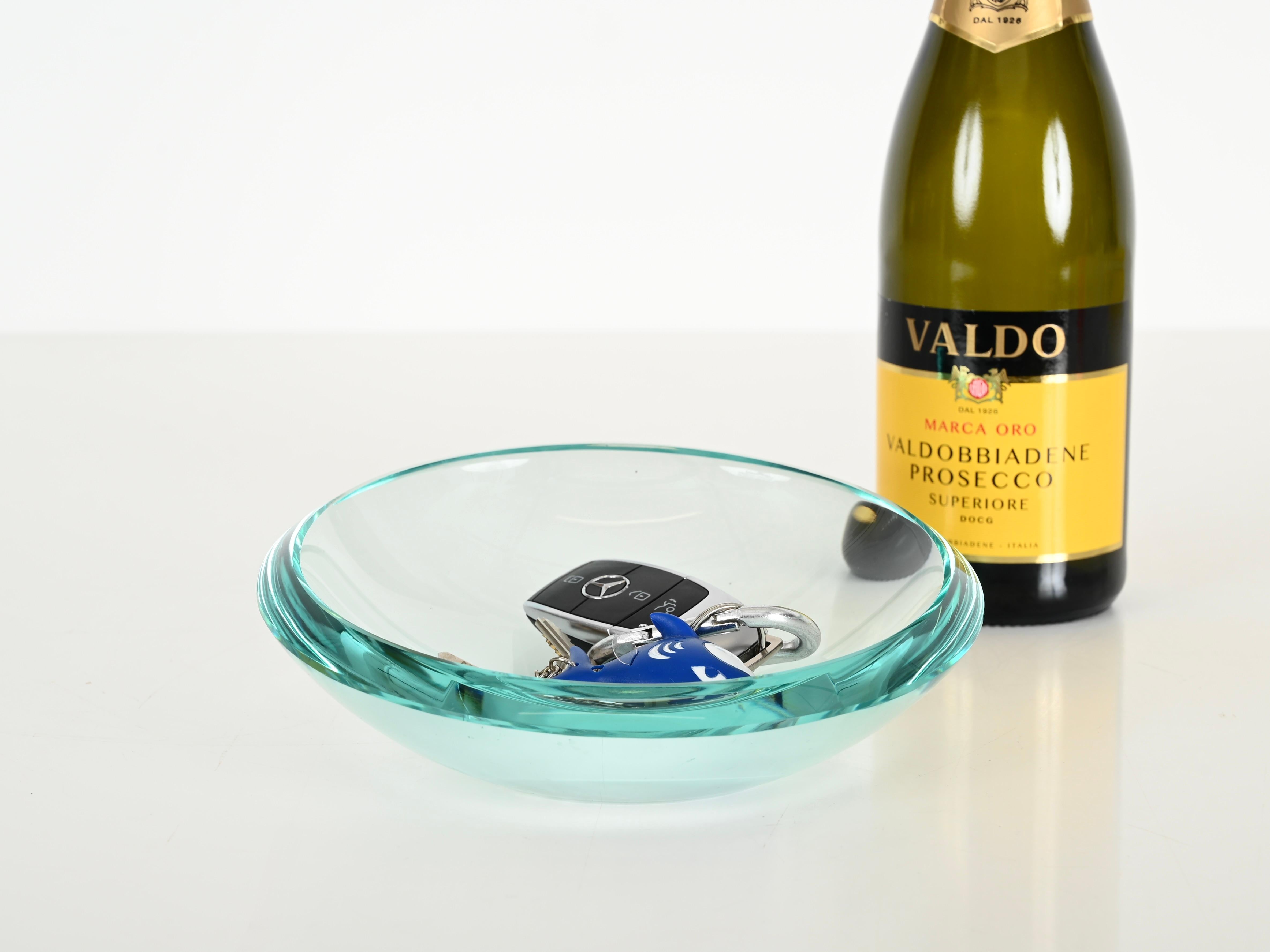 Spectacular bowl or vanity tray in a marvelous light turquoise beveled crystal, designed by Max Ingrand and produced by Fontana Arte in Italy during the 1950s.

This fantastic piece is fabulous condition with no chips, cracks or scratches. The