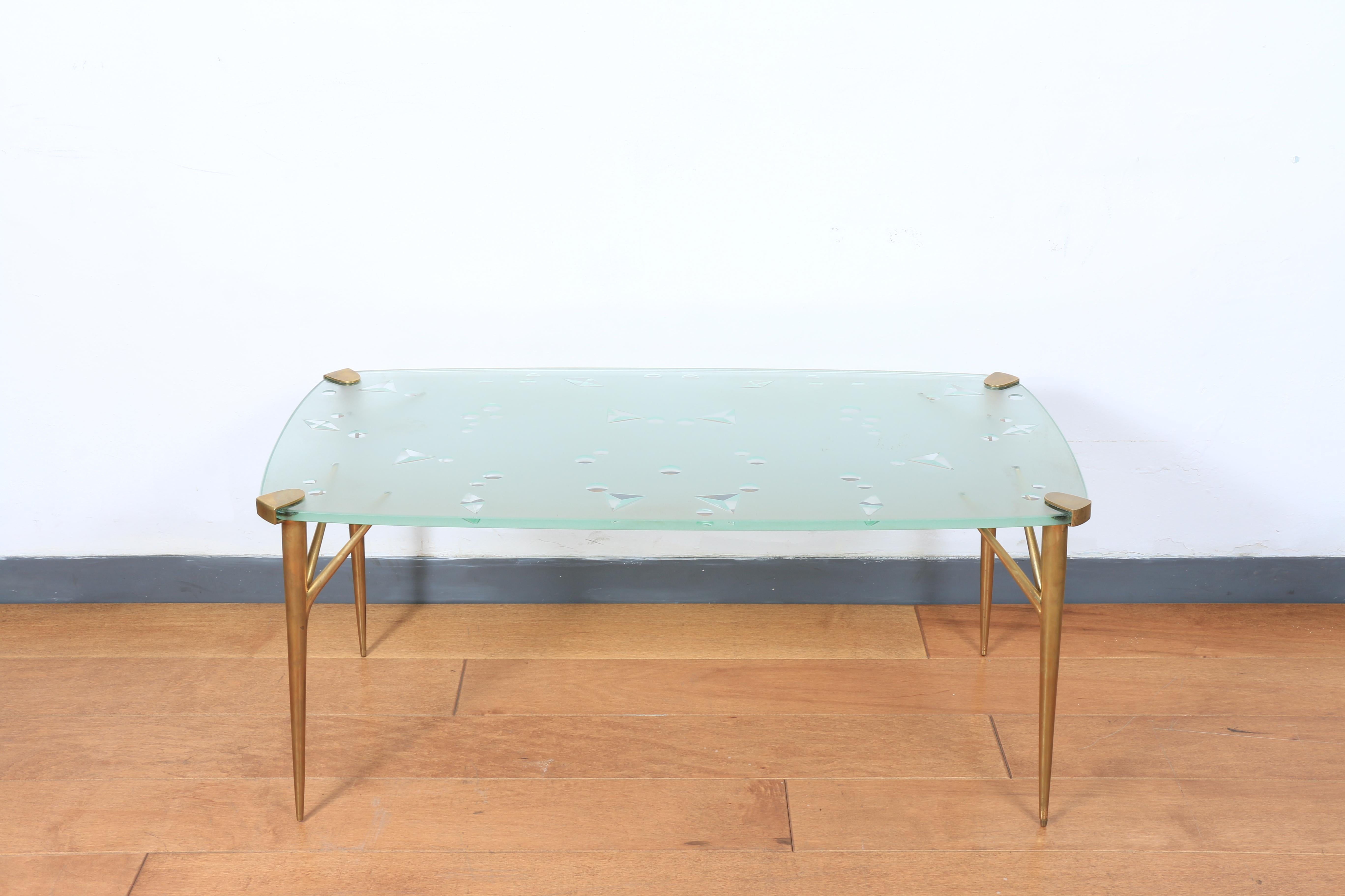 Gorgeous brass legs coffee table with beveled designed glass top. No damages on legs or on glass top. Will look amazing in any place!