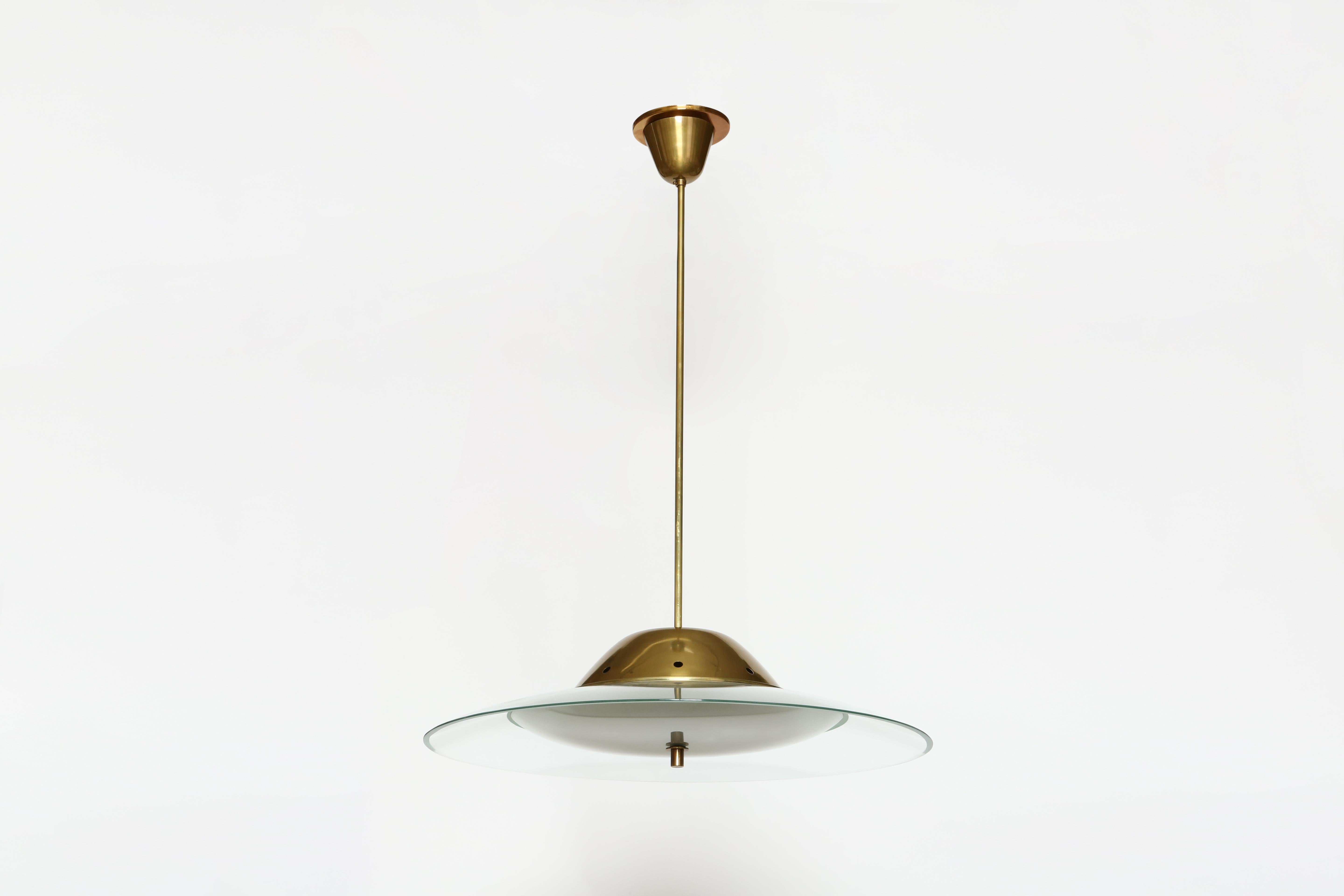 Max Ingrand for Fontana Arte ceiling suspension model 1239
Designed and made in Italy, 1960s
Takes 3 medium base bulbs.
Rewired for US.
Brass was beautifully restored.
Overall drop is adjustable. Stem can be made shorter.
Body of the fixture is 6