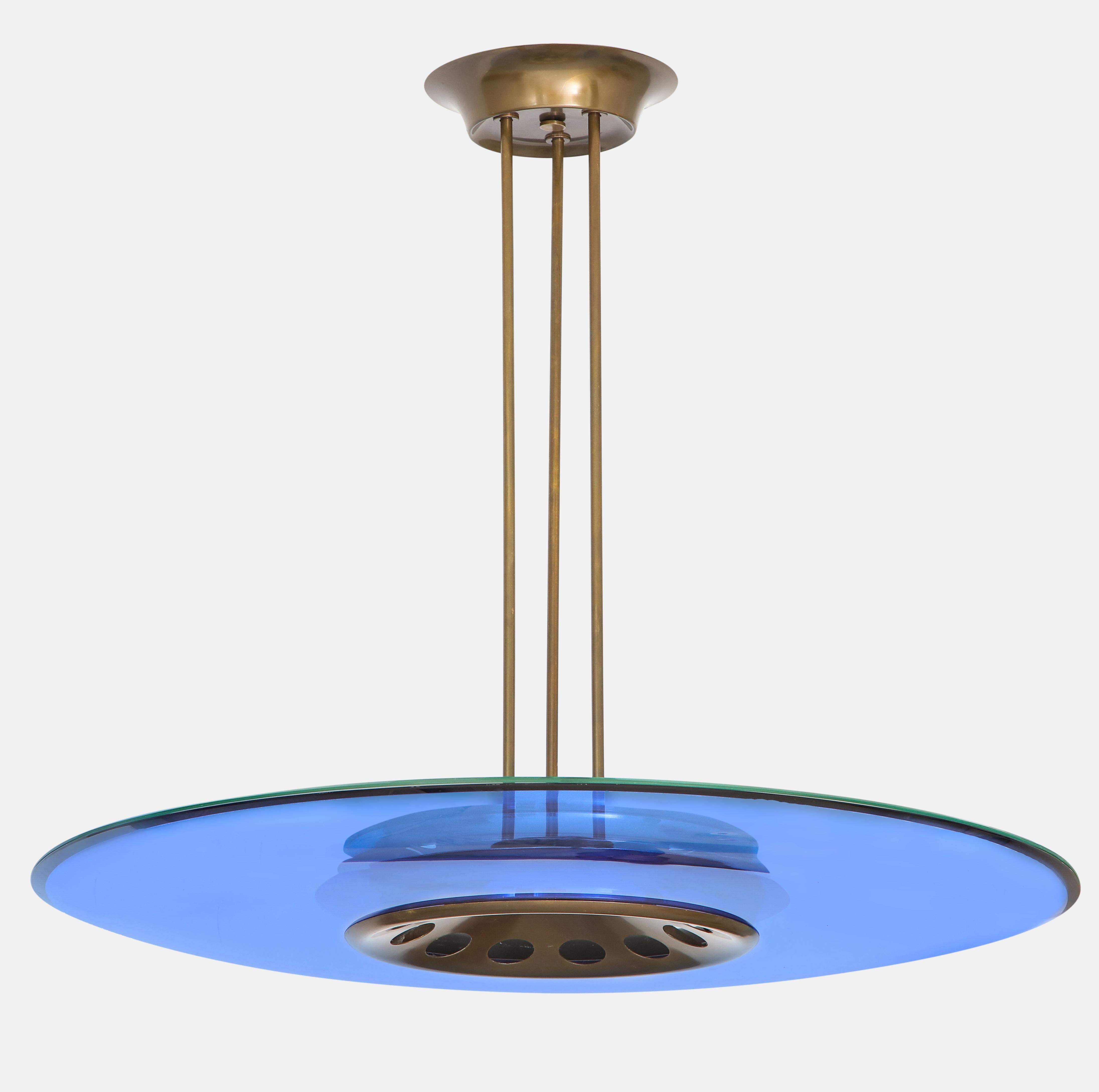 Max Ingrand for Fontana Arte stunning sculptural chandelier with large blue polished beveled glass disc on bottom and clear polished beveled glass disc on top suspended by brass structure with three rods and original canopy. The chandelier holds