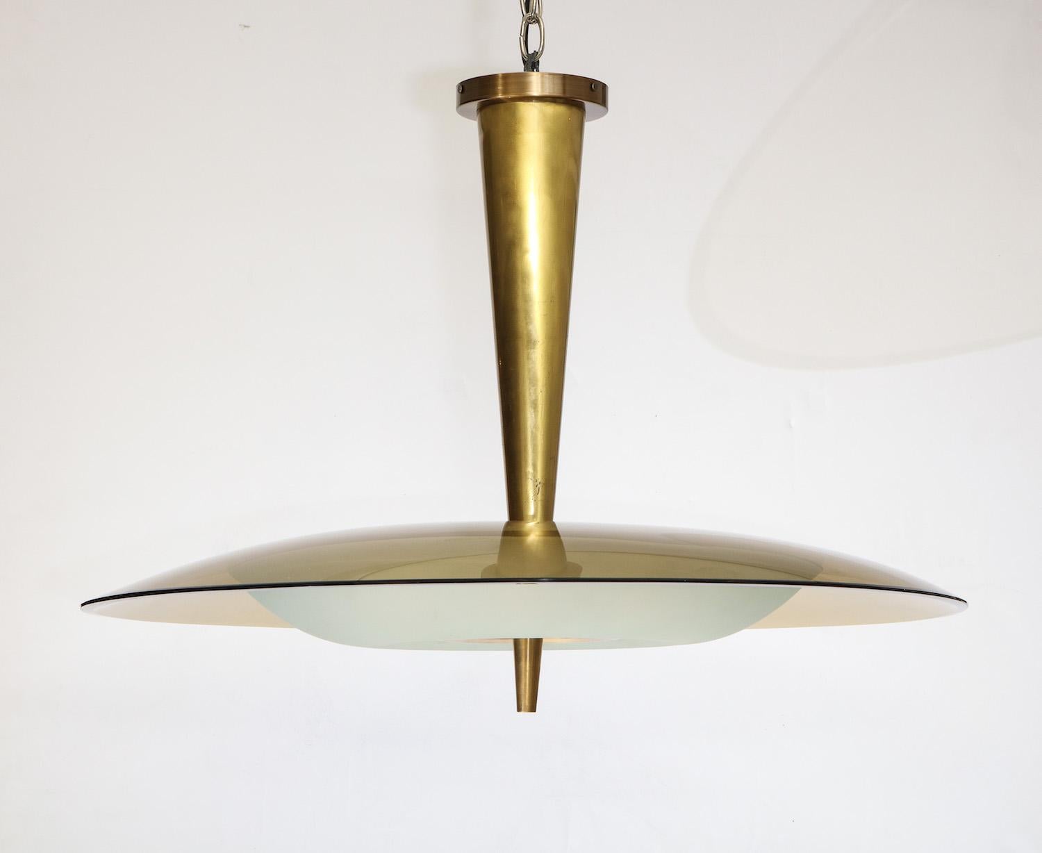 Rare pendant #1462 by Max Ingrand for Fontana Arte. Fantastic Max Ingrand saucer pendant featuring a large bronze glass dish and a lower acid-etched bowl with brass mounts. 8 candelabra sockets, recently replaced and newly rewired. Published: