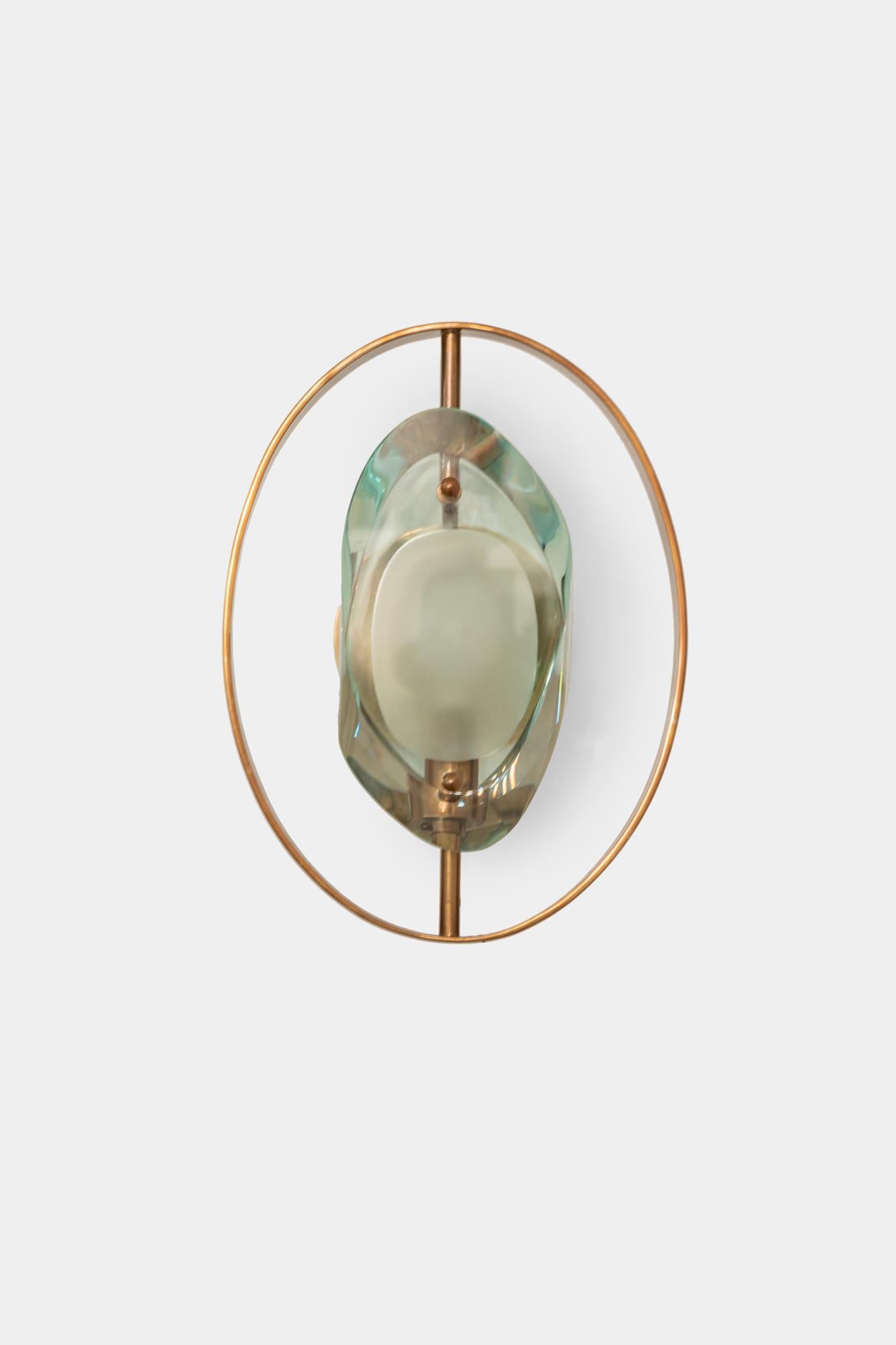 Max Ingrand for Fontana Arte rare pair of 'Micro' sconces model 2240 with double lens cut panels of thick profiled polished glass with etched glass centers and brass fittings.
Newly rewired to U.S. standards with custom