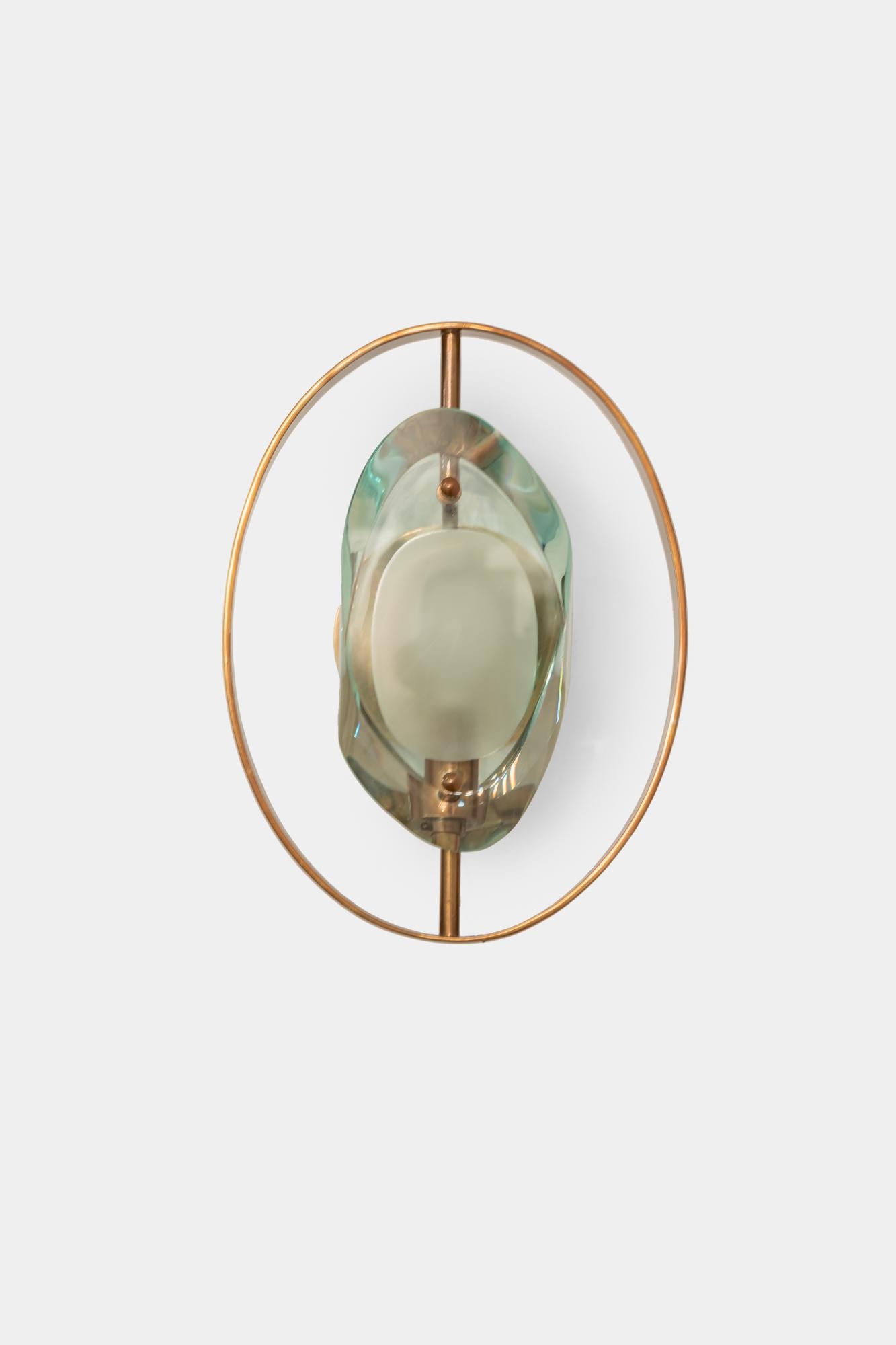 Max Ingrand for Fontana Arte rare pair of elegant 'Micro' sconces model 2240 with double lens cut panels of thick profiled polished glass with etched glass centers and brass fittings.
Newly rewired to U.S. standards with custom