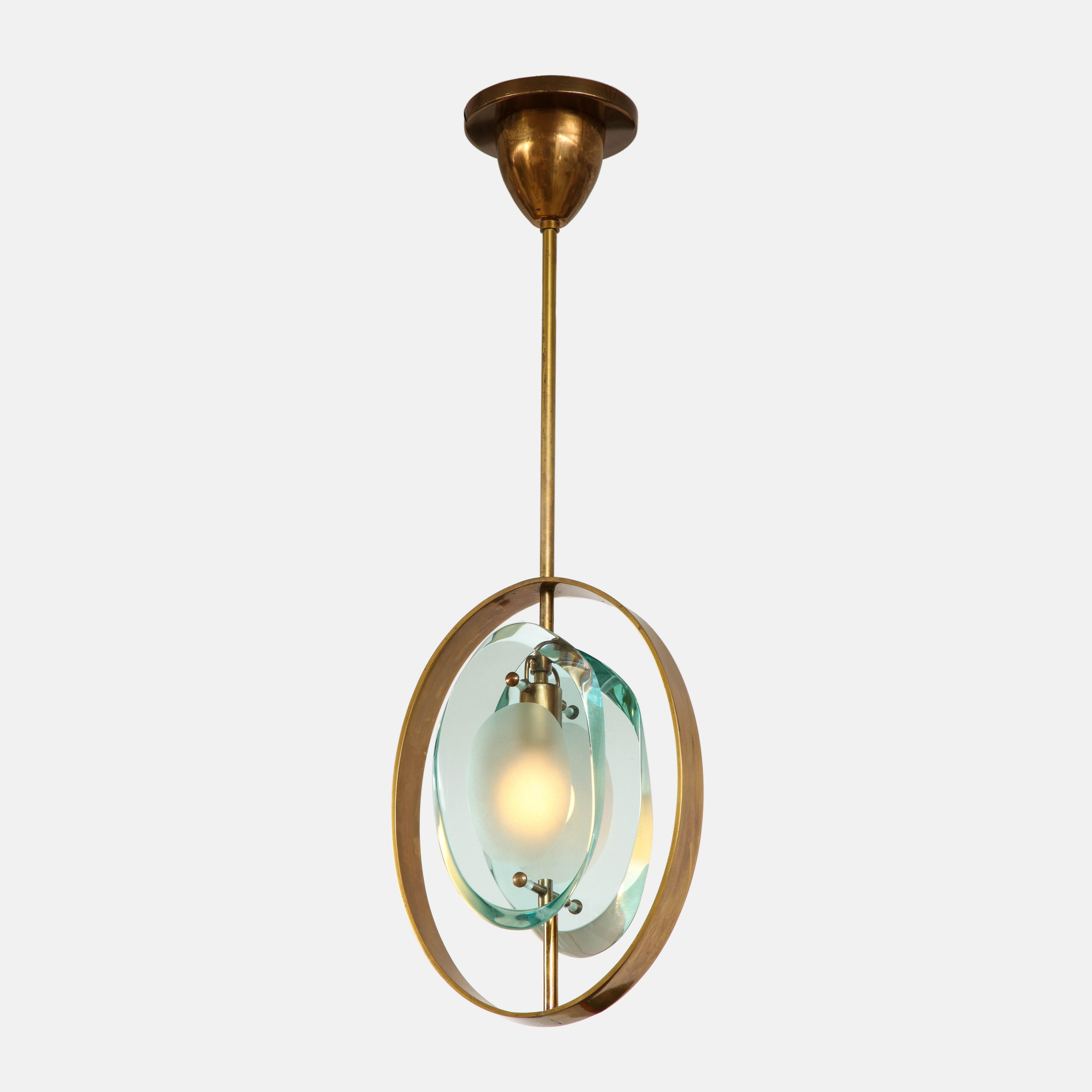 Max Ingrand for Fontana Arte exquisite pendant ceiling light model 1933 composed of double lens-cut plates of thick profiled polished glass with frosted glass centers suspended from brass structure with original canopy and custom ceiling plate,