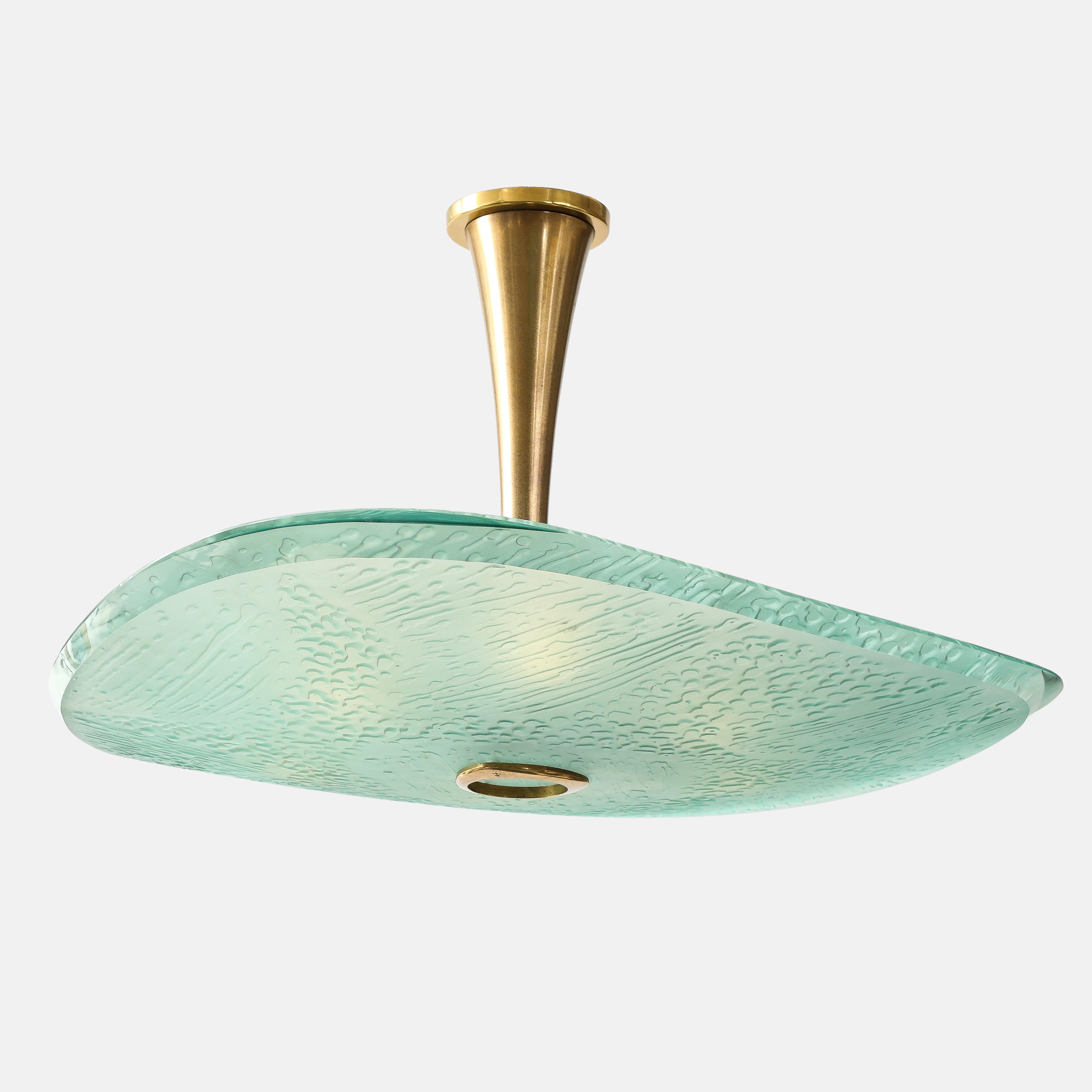 Max Ingrand for Fontana Arte rare exquisite ceiling light or chandelier model 2067 featuring a large thick acid-etched crystal glass diffuser with polished beveled edges supported by a central brass stem ending in a decorative brass element.  This