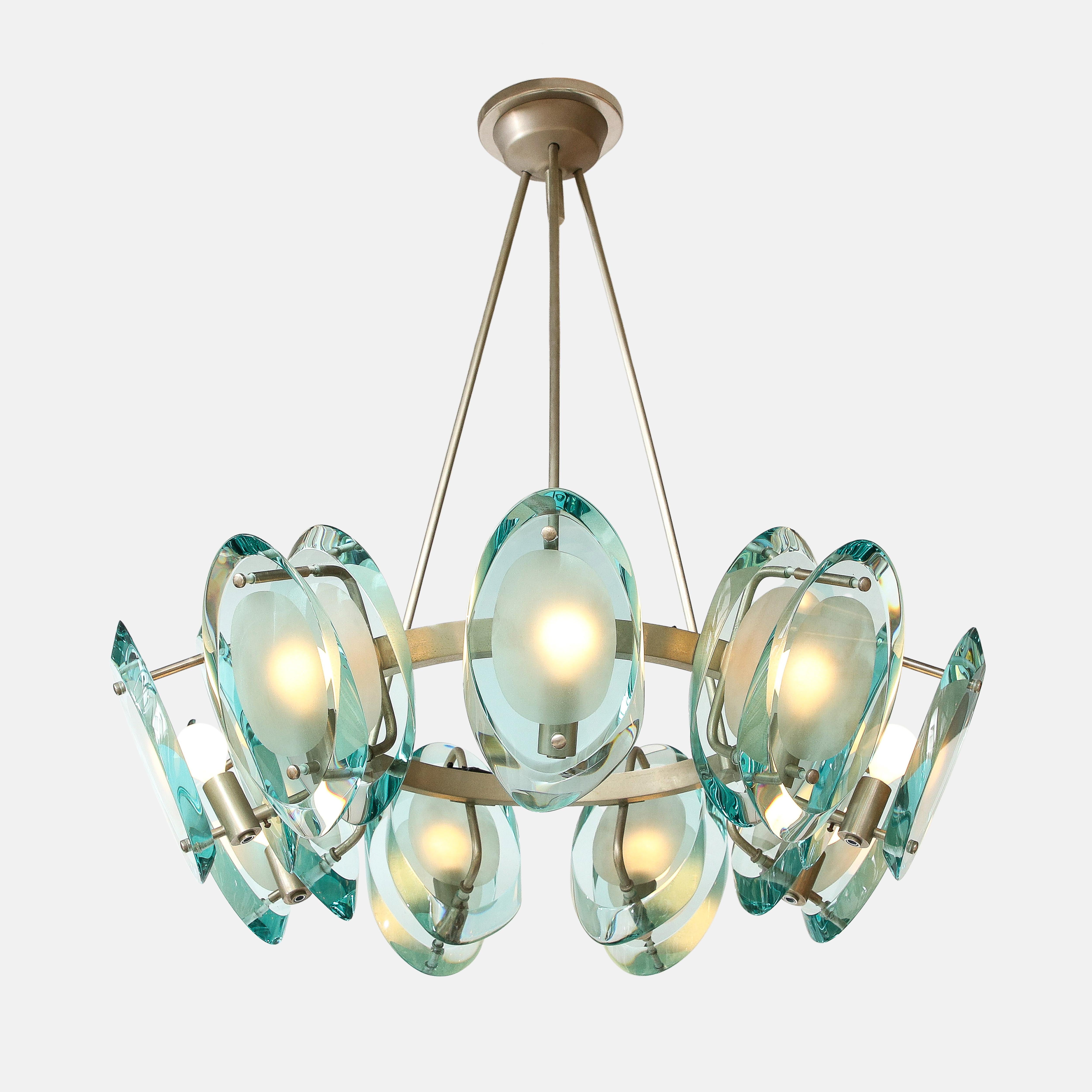 Max Ingrand for Fontana Arte rare and extraordinary chandelier model 2088 consisting of nine double lens cut panels of thick profiled polished glass with partially sand-blasted glass centers mounted on a circular nickel-plated brass structure with