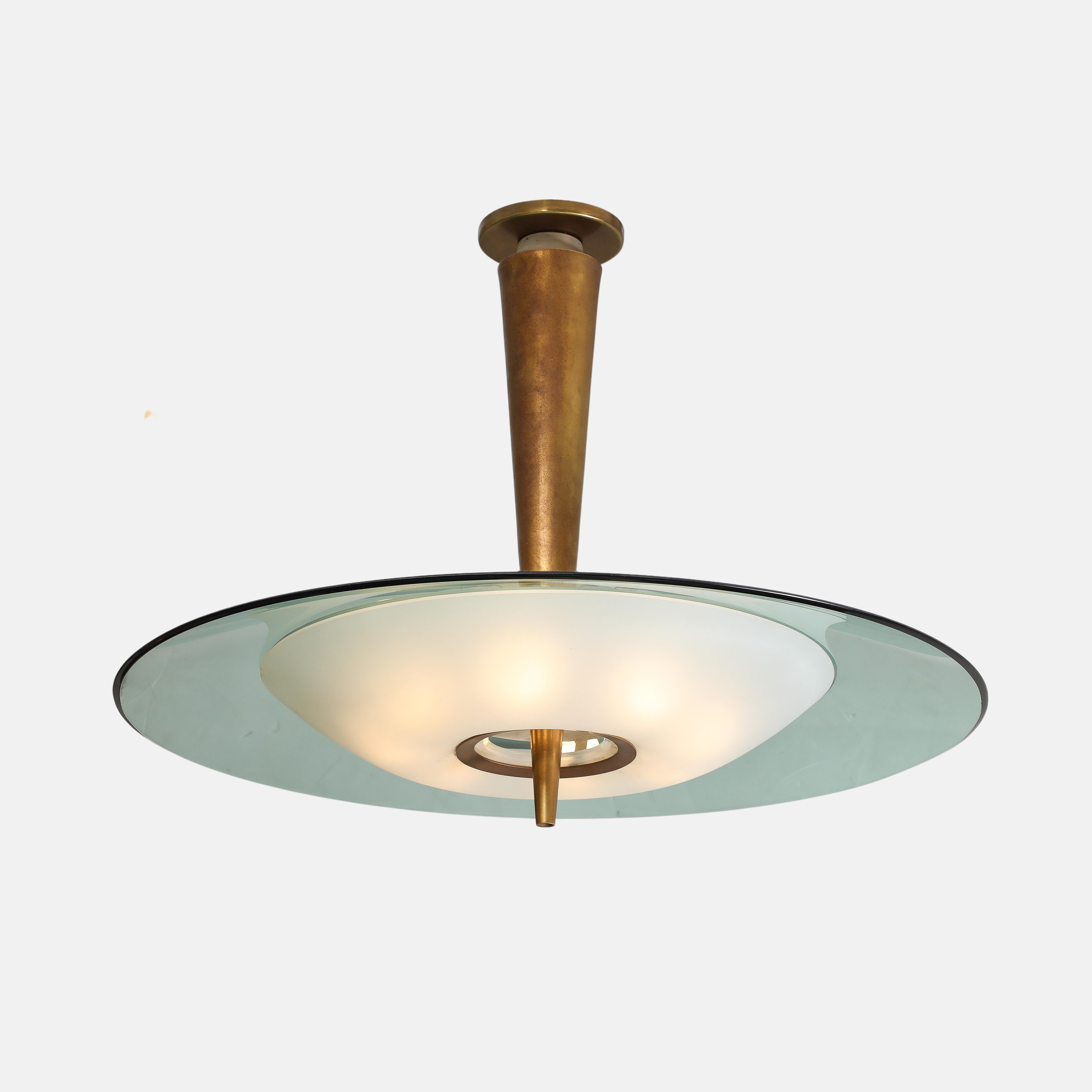 Max Ingrand for Fontana Arte rare pair of pendant lights or chandeliers model 1462 each consisting of large green beveled and polished crystal glass disc and smaller frosted glass diffuser mounted on tapering lacquered brass stem.
This exquisite and