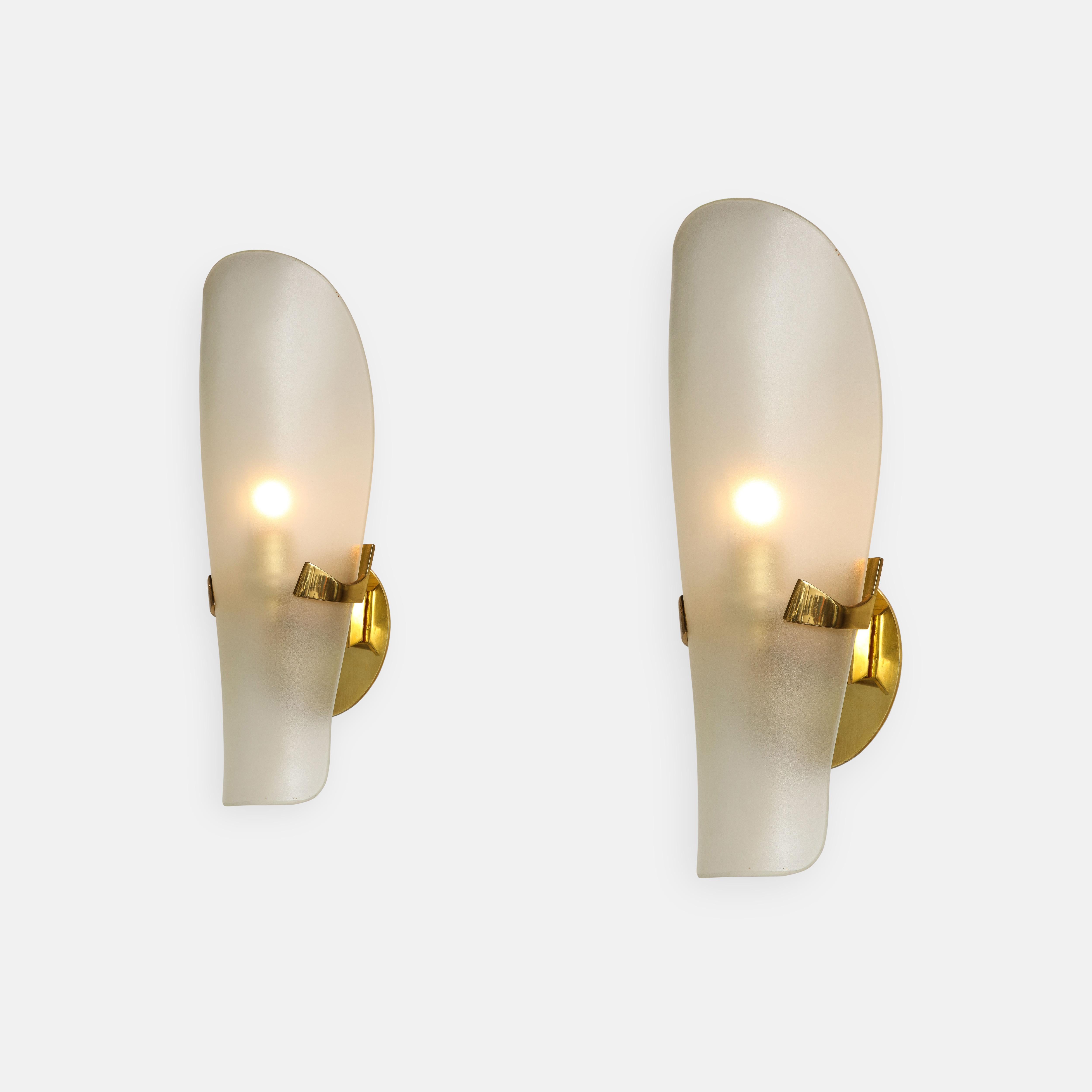 Max Ingrand for Fontana Arte rare pair of sconces model 1636 with curved shield-shaped satin or acid-etched glass diffuser on brass mounts. 
Newly rewired to U.S. standards with custom backplates.

Literature:
Fontana Arte, manufacturer's