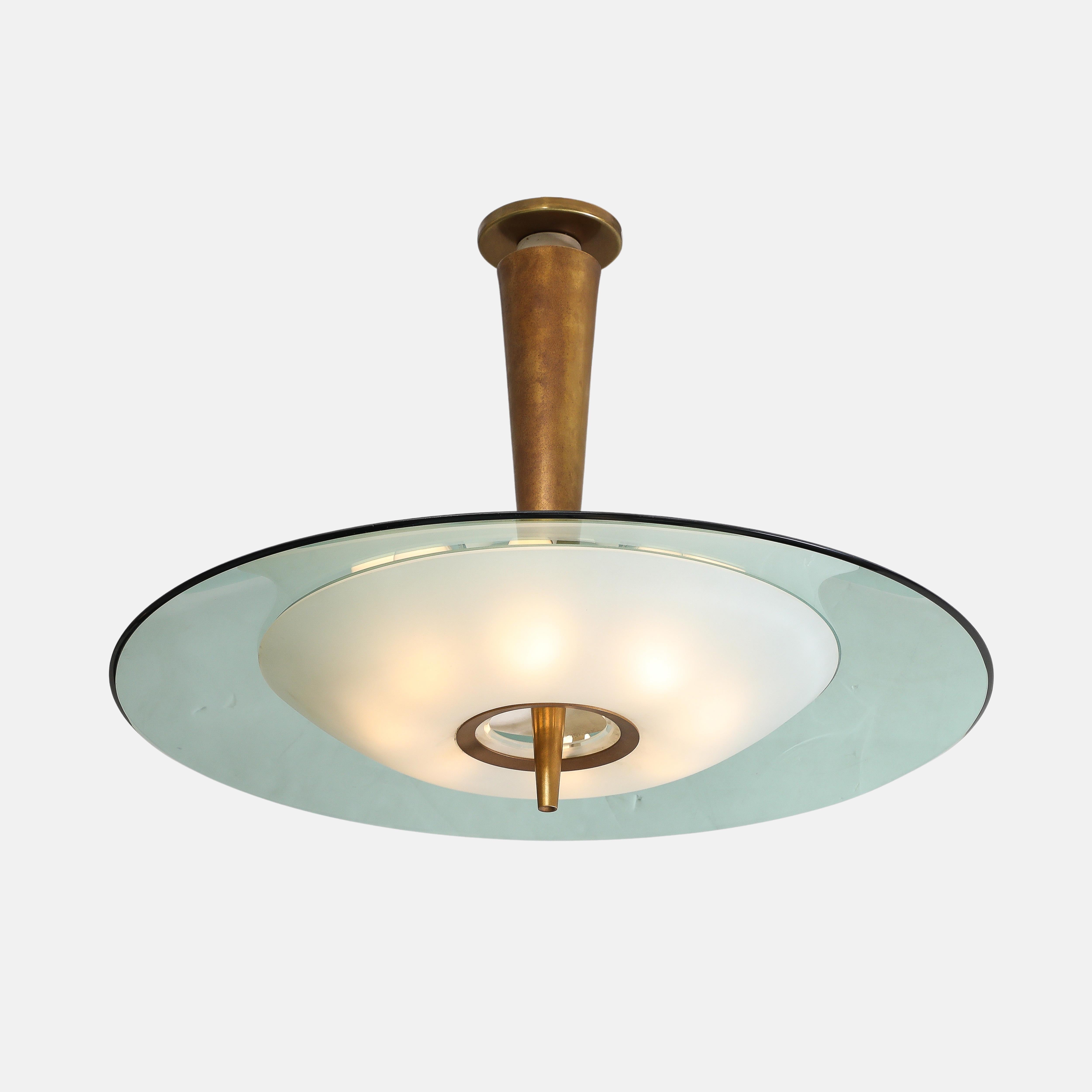 Max Ingrand for Fontana Arte chandelier or pendant light model 1462 consisting of large colored, beveled and polished crystal glass disc and smaller frosted glass diffuser mounted on tapering lacquered brass stem.  
This exquisite ceiling light has
