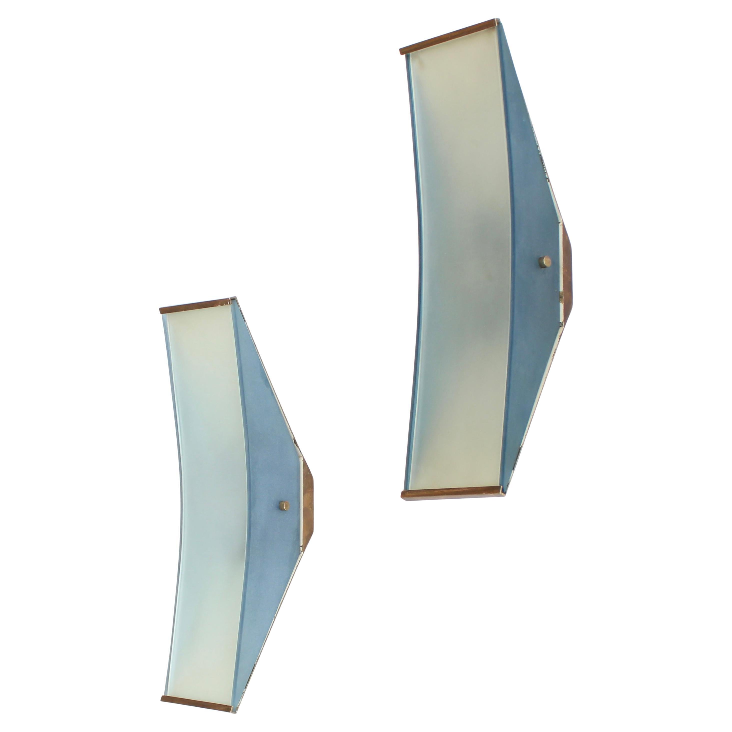 Satin glass panels of natural glass on the face and pale blue glass on the sides with polished brass structures and metal interior structure..Max Ingrand for Fontana Arte Model #2125
2 candelabra sockets per sconce..Very good condition. Oxidation to