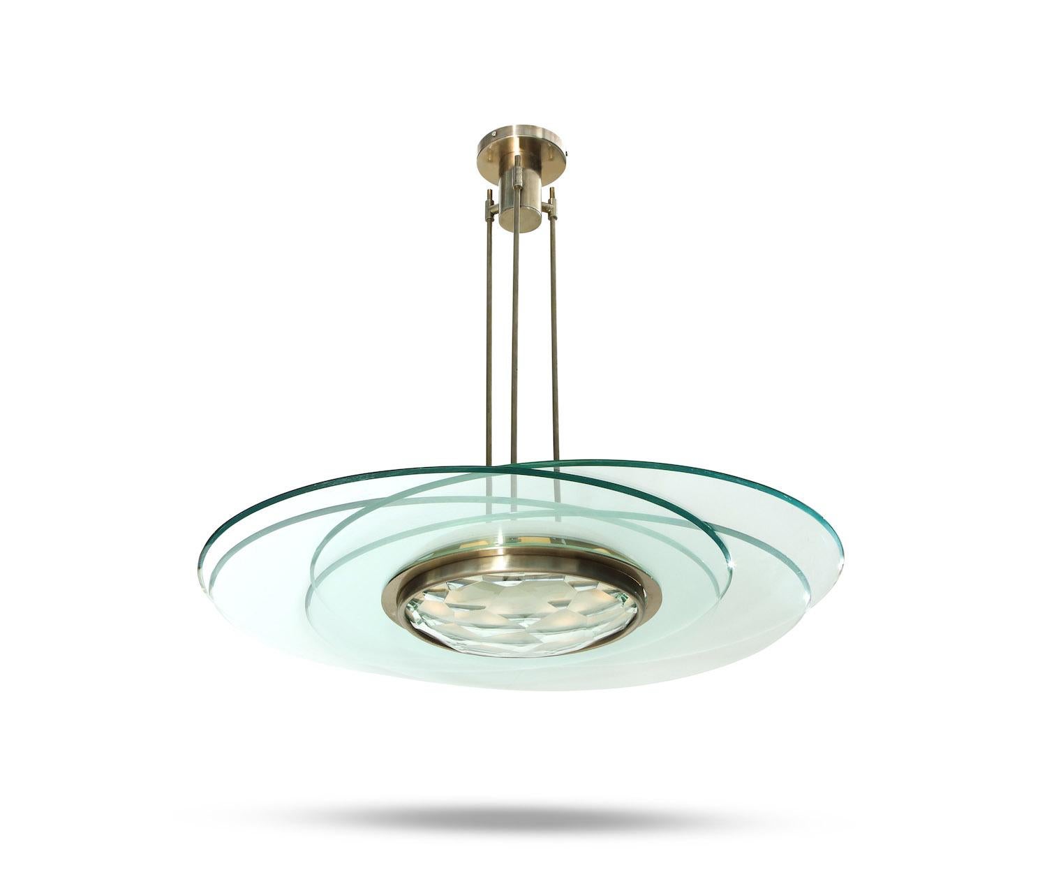 Max Ingrand for Fontana Arte rare hanging light. Model #2127 comprised of 4 large circular glass panels with beveled edges that are placed around the centre of the fixture. Centre glass bowl with faceted outer face and metal surround. 8 Candelabra
