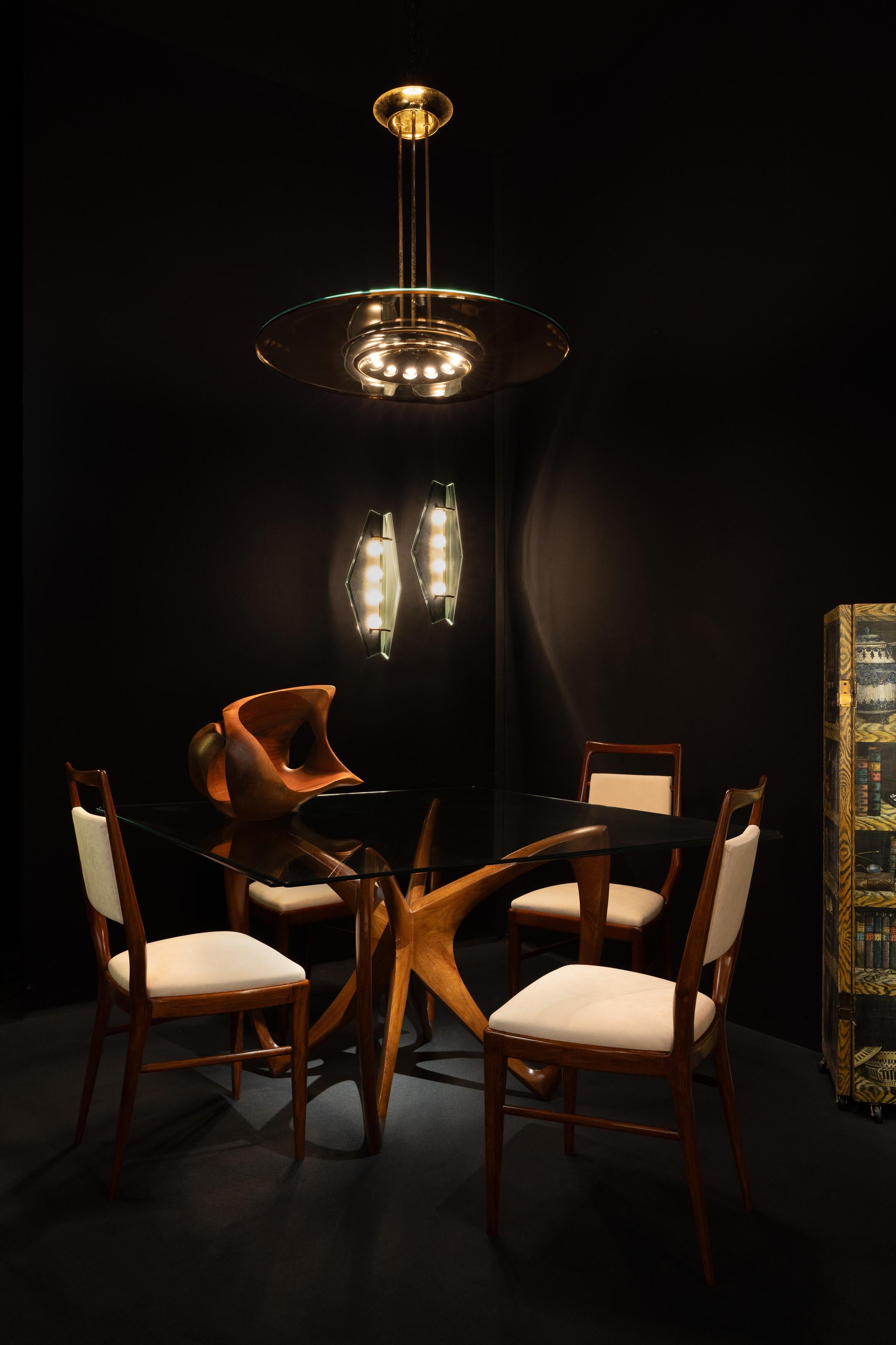 Rare pair of large wall lamps model 1943 designed by Max Ingrand and manufactured by Fontana Arte in Italy in 1961. These lamps have a beautiful form consisting of two elements of glass making a diamond shape. These shades of glass are etched which