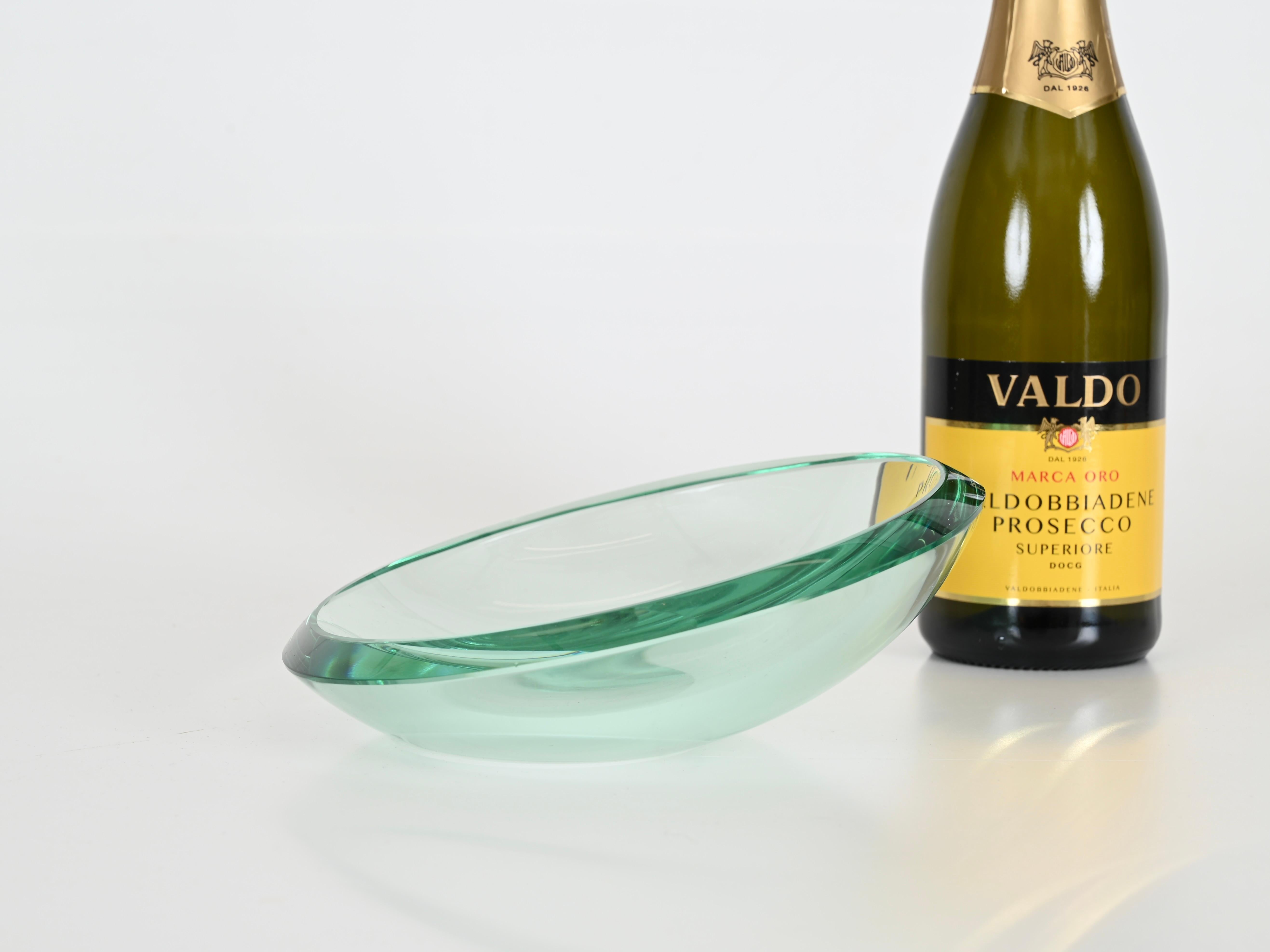 Fabulous bowl or vanity tray in a wonderful Nile green beveled crystal, designed by Max Ingrand and produced by Fontana Arte in Italy during the 1950s.

This fantastic piece is fabulous condition with no chips or cracks. The sinuous shape and the