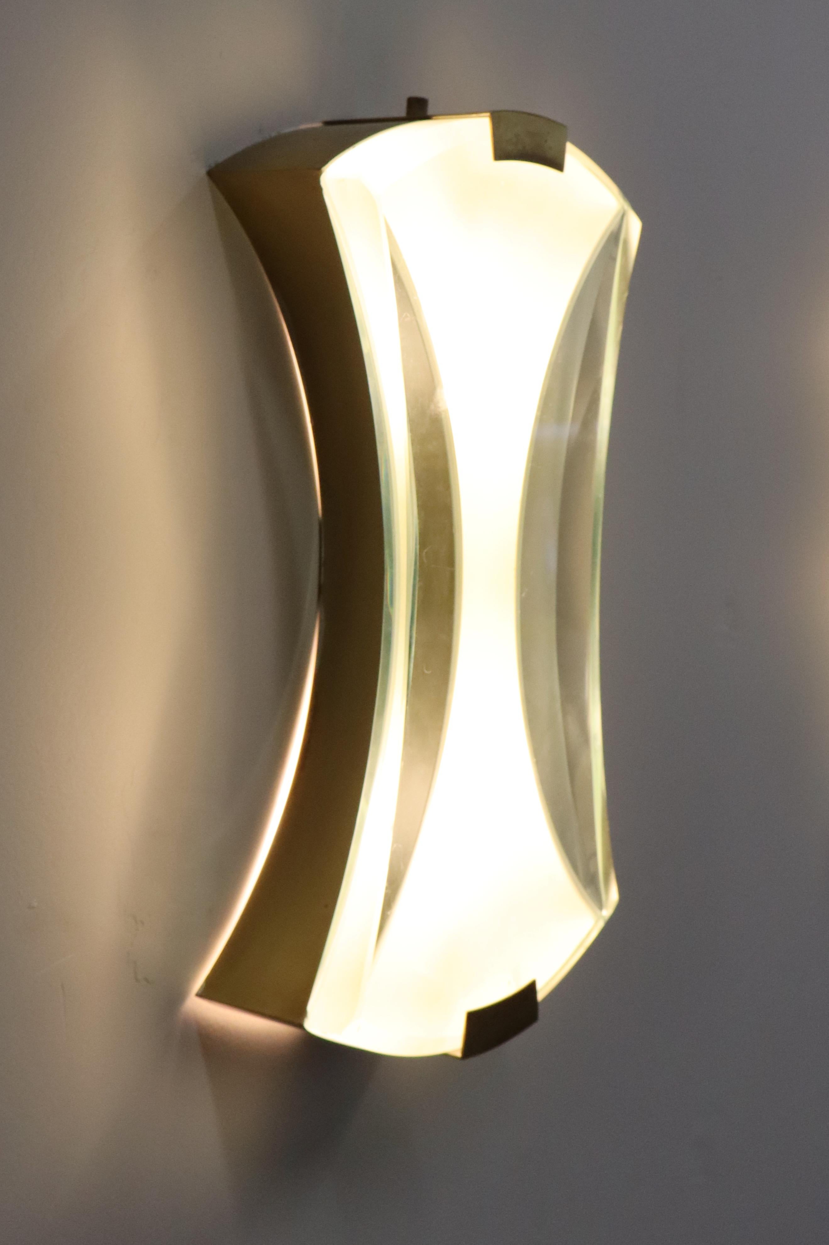Max Ingrand for Fontana Arte rare pair of elegant modernist sconces model 2225 with central satin or acid-etched glass and outer clear polished glass suspended by brass fittings.
Franco Deboni, Fontana Arte: Gio Ponti, Pietro Chiesa, Max Ingrand,