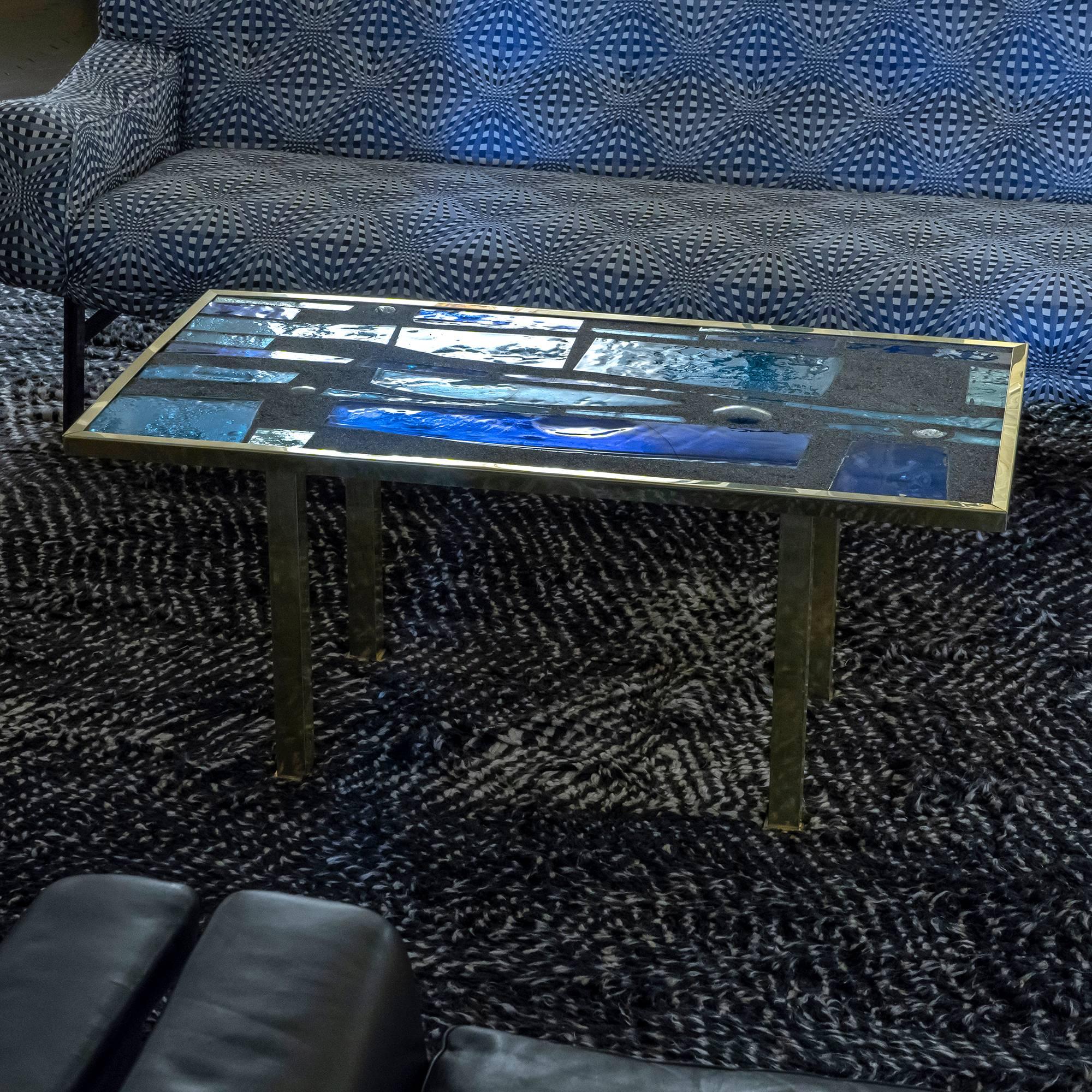 Coffee table in the style of Max Ingrand with decorative top realized in cement and different shades of blue mirrored glass elements, natural brass structure with perfect vintage patina, France, circa 1960.