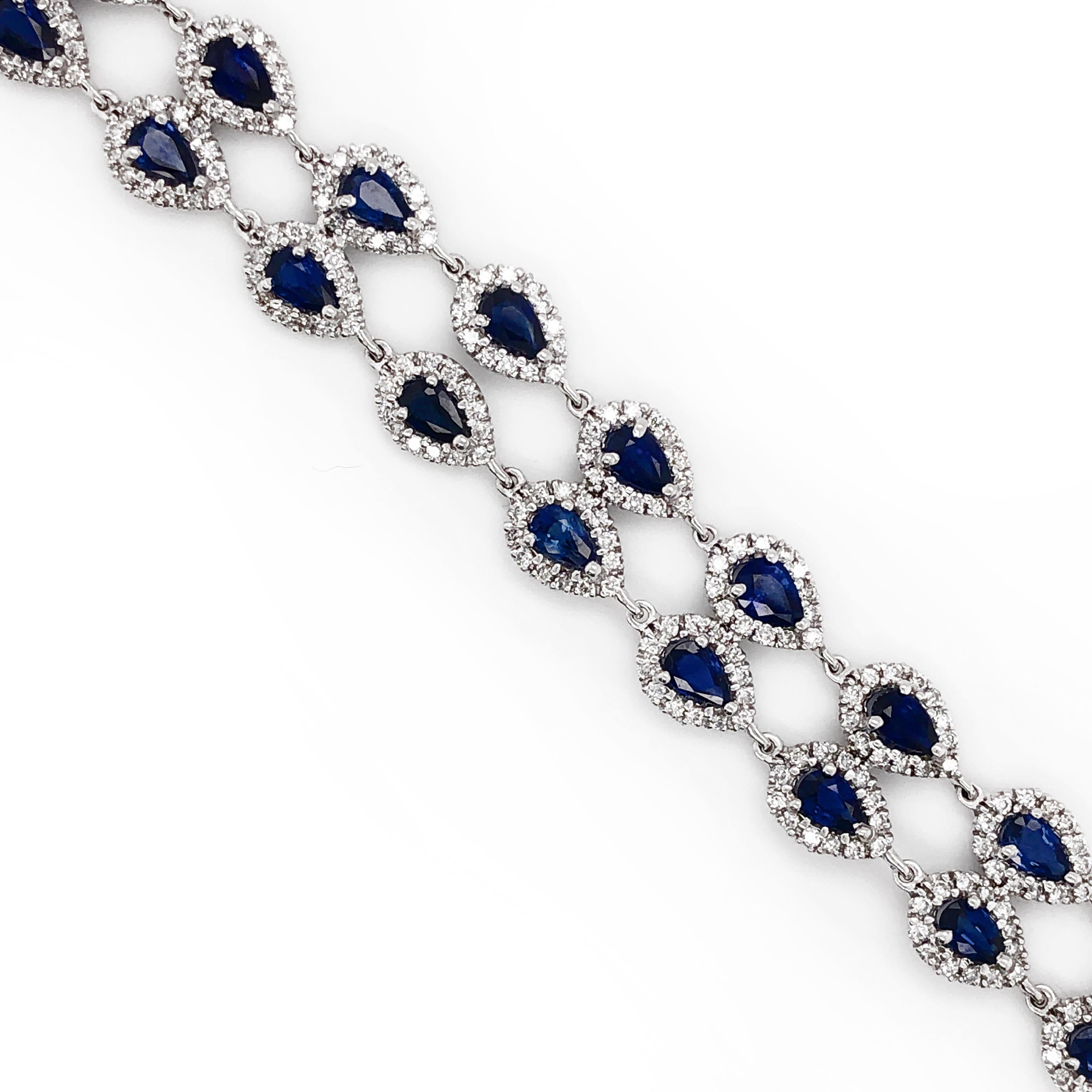 A classic platinum 950 bracelet adorned with pear cut deep blue Ceylon sapphires 12.91 ct surrounded by white diamonds 3.68 ct. Diamonds are natural and G-H Color Clarity VS.   Art Deco inspired. A classic and elegant design, a timeless piece you