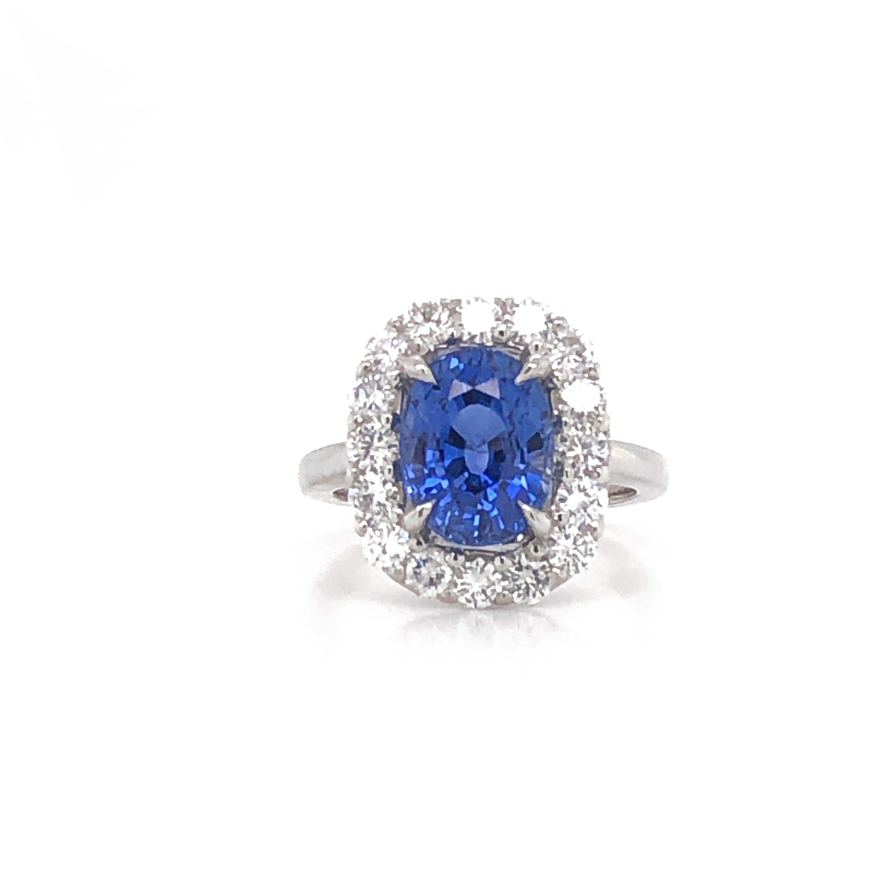 Cocktail ring crowned with a blue cushion oval cut ceylon sapphire 4.69 ct. 
Surrounded by round white natural diamonds 1.28 ct in G-H Color Clarity VS.
Ring is platinum 950 metal. 
Length: 1.6 cm
Width: 1.3 cm
Weight: 10.23 g . 