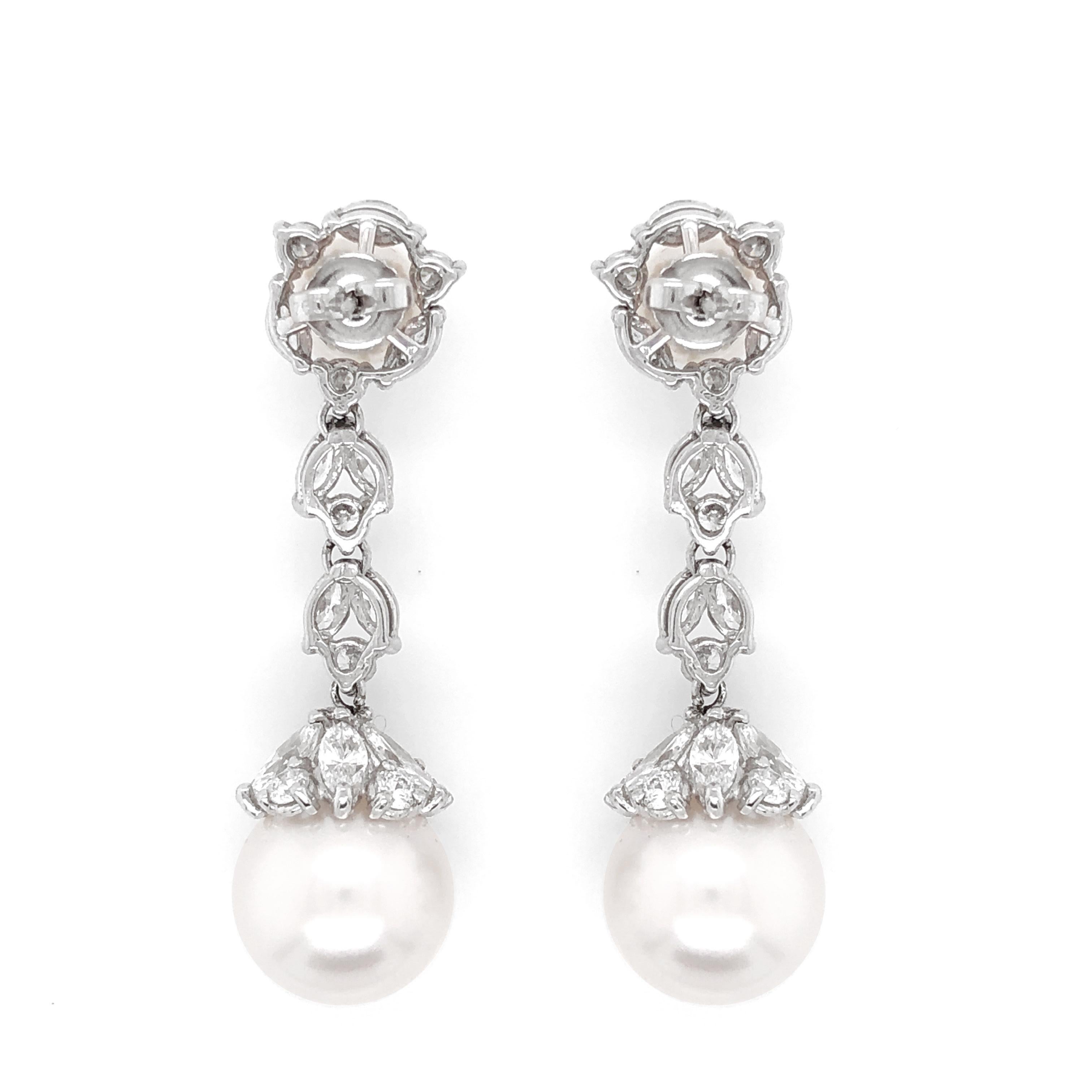 Hanging pearl dangle earrings with round / marquise combination cut natural white diamonds 5.09 ct in total.
Diamonds are in G-H Color Clarity VS. 
Pearls are freshwater and round ( top is 7.5 mm and bottom is 13.8 mm ).
Classic back stud.  
Length: