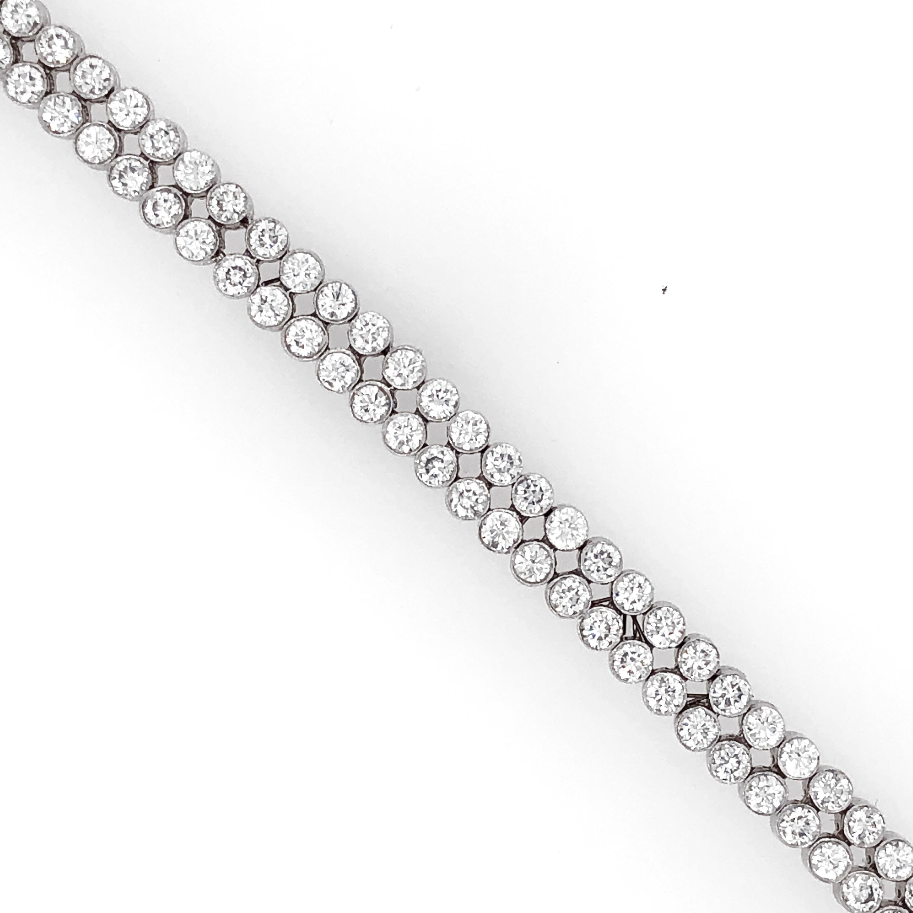 Elegantly slim dual row tennis bracelet.
Platinum 950 bracelet.
Round white natural diamonds 8.59 ct.
Diamonds in G-H Color Clarity VS.
Length: 17.5 cm
Width: 0.6 cm
Weight: 34.6 g