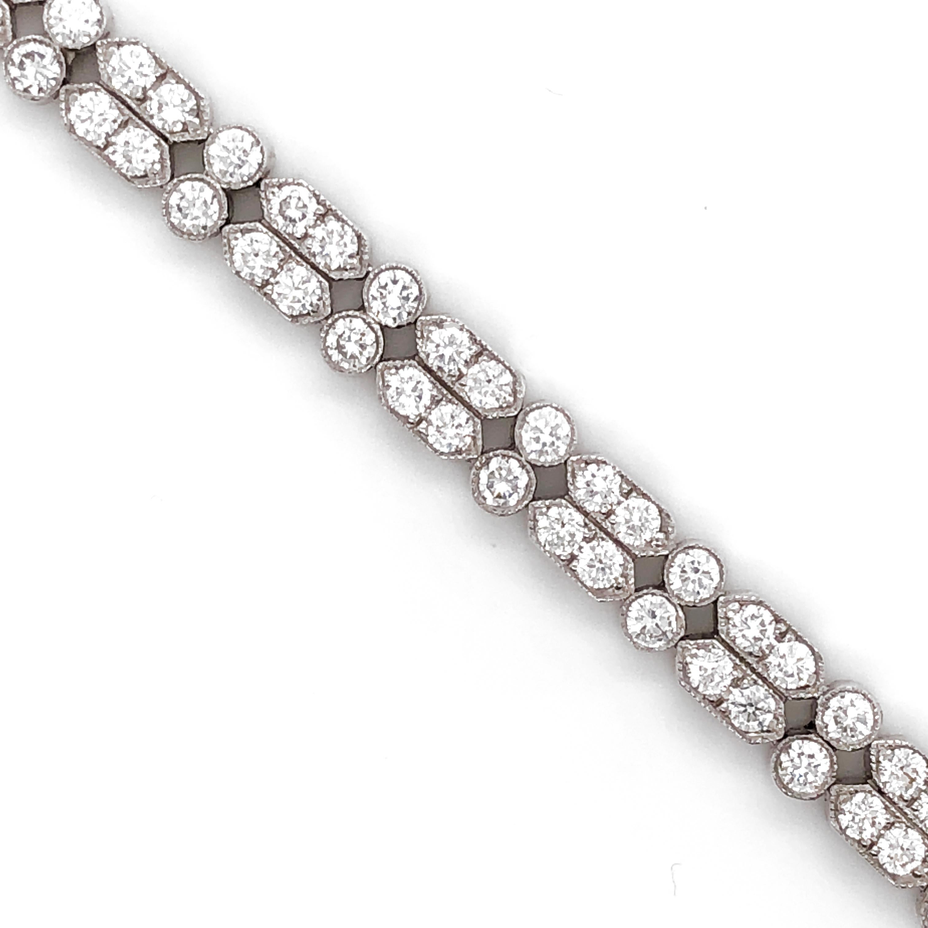 A very feminine, slim and elegant platinum 950 tennis bracelet.
White round natural diamonds 6.73 ct.
Diamonds in G-H Color Clarity VS.   
Dual row contemporary design. 
Length: 18 cm
Width: 1.6 cm
Weight: 26 g