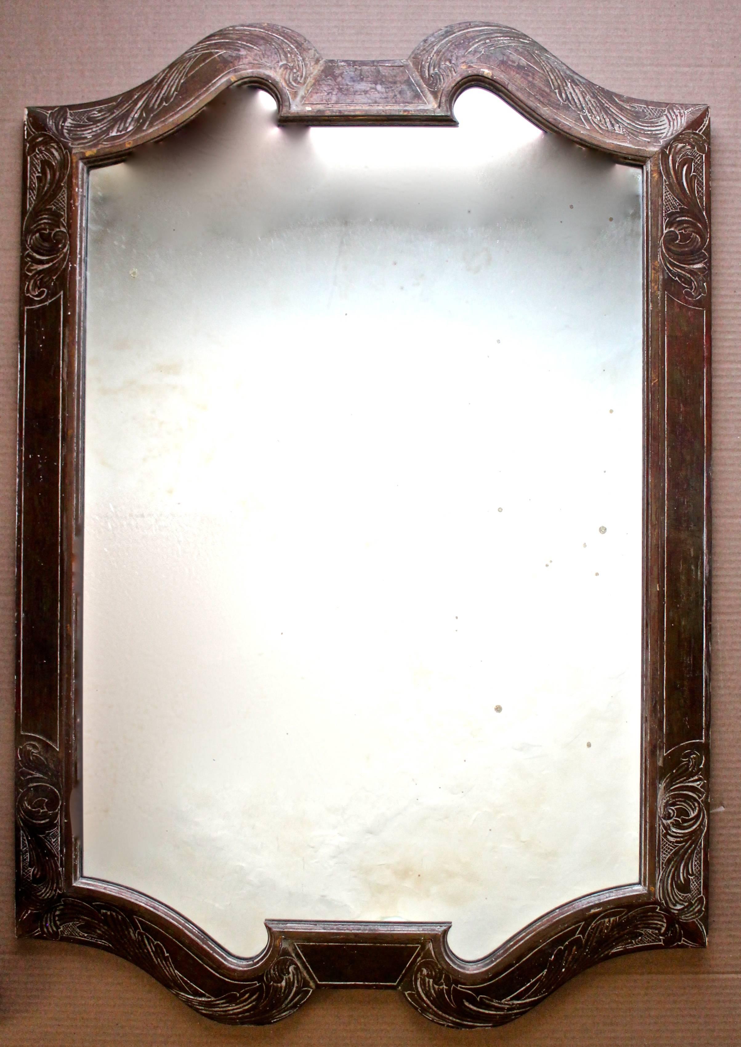 A carved, and boulle under silver leaf finish frame with mirror in the Prendergast Kuehne tradition.