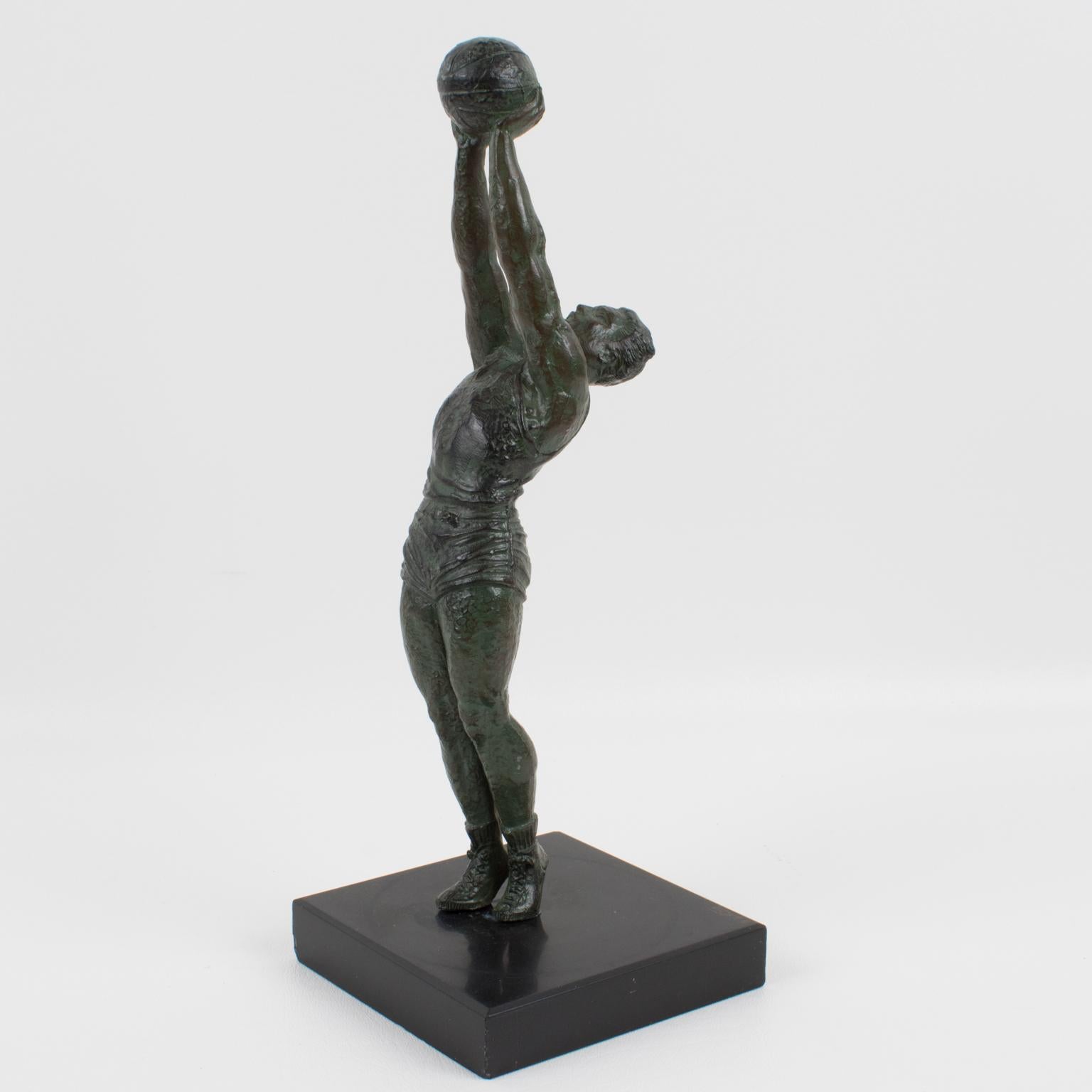 Lovely Art Deco bronze sculpture by French artist Max le Verrier (1891 - 1973). Very interesting sports memorabilia with a basketball player in action. Dark green patina to the statuette. The base is in black marble. Incised signature on the black