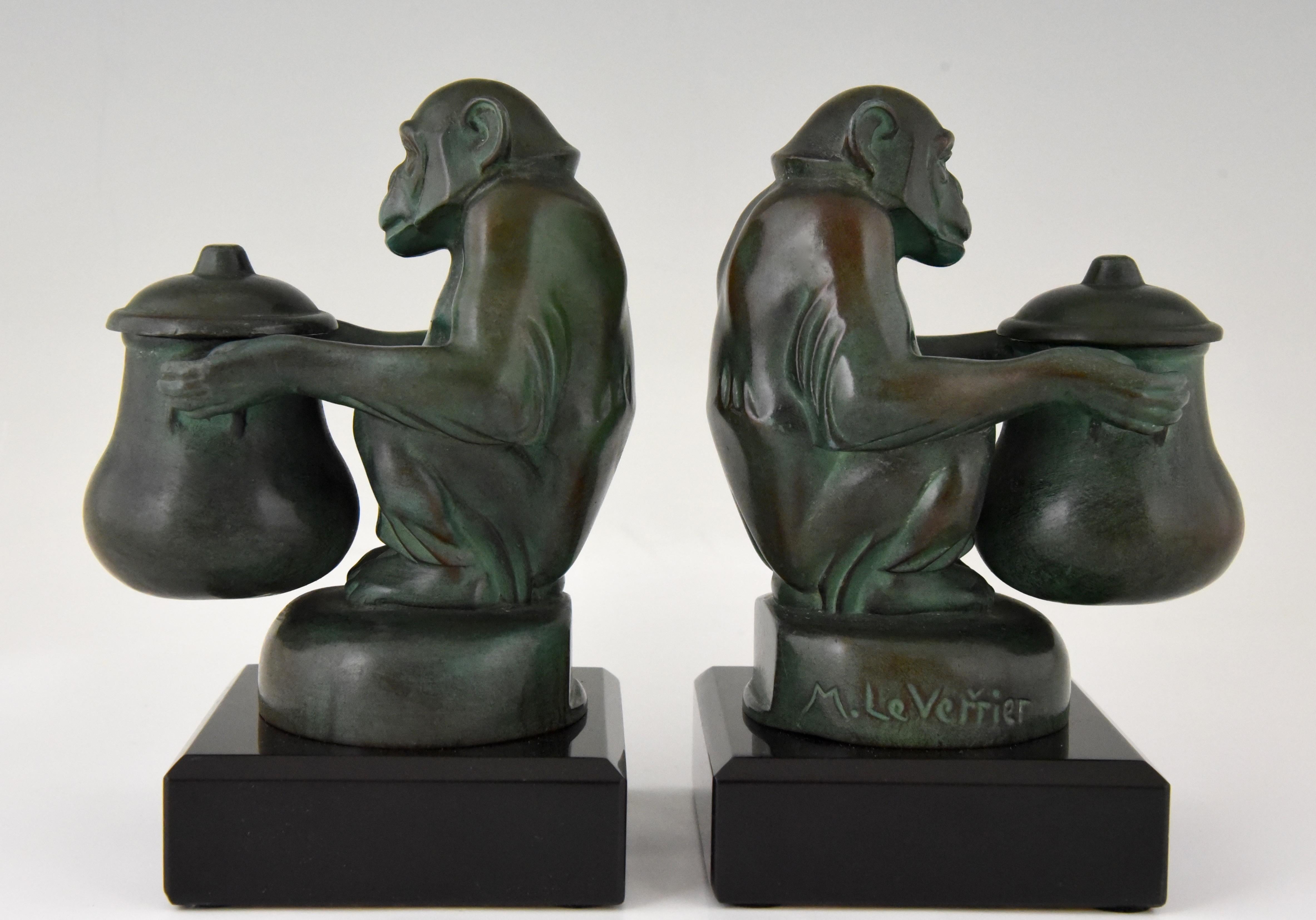 A nice pair of Art Deco monkey bookends by the famous French artist Max Le Verrier. 
Each monkey is holding an inkwell in the shape of a jar. 
The sculptures are mounted on marble bases and are signed by the artist, circa 1930. 

“Art Deco