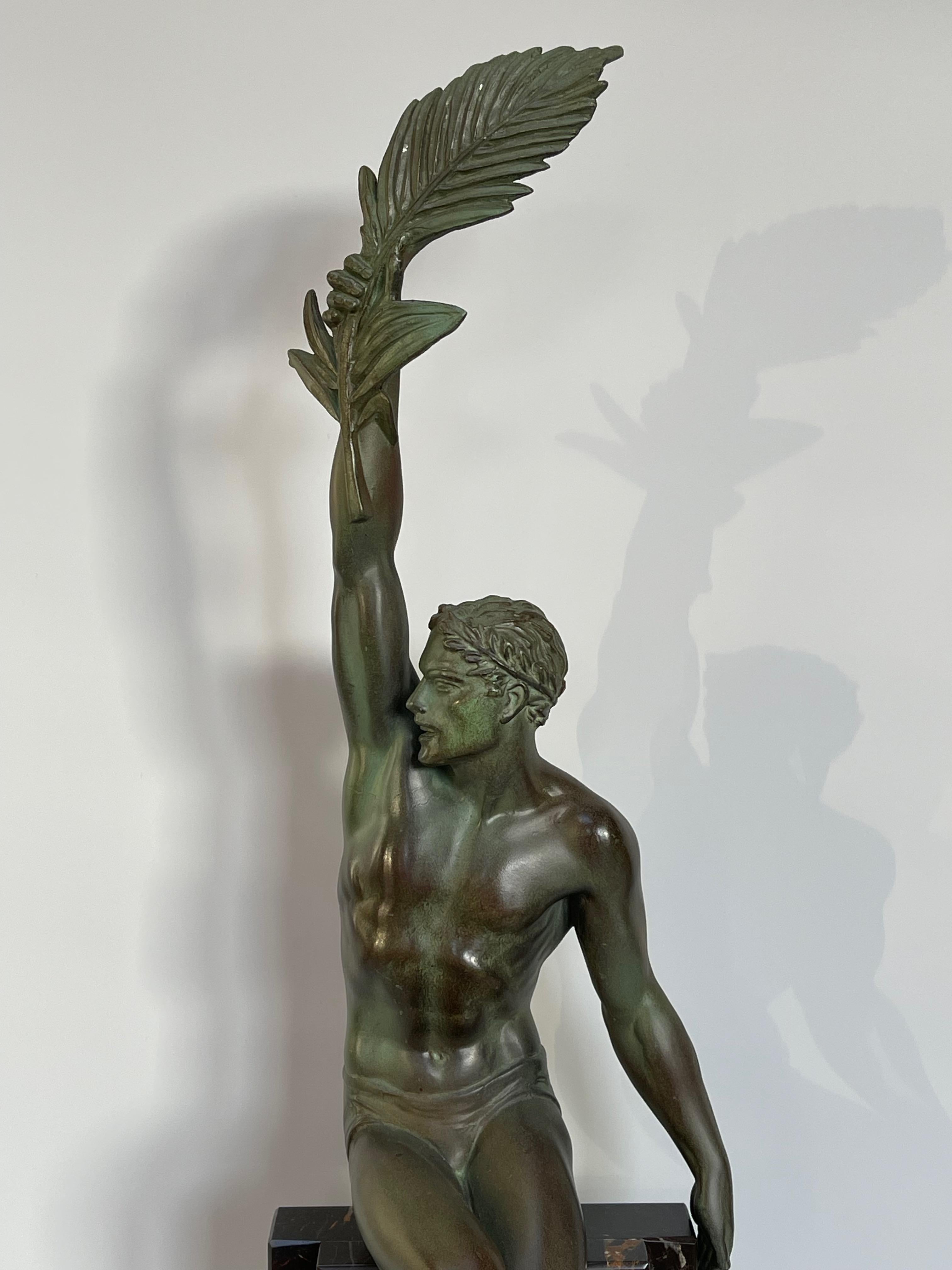 Art deco sculpture in spelter by Max le verrier with green patina on a black veined marble base, Gloire model by le Faguays, signed on the marble.
Length: base 16cm
Depth: 10cm
Height: 61cm
Weight: 7Kg

Louis Octave Maxime Le Verrier was born to a