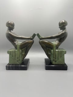 Pair of bookends titled “Délassement”